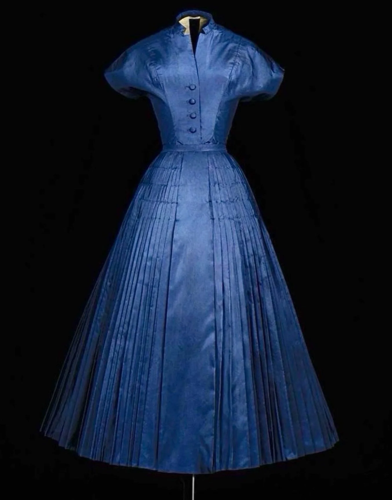Christian Dior&rsquo;s exquisite Cherie dress, in navy blue silk taffeta with a pleated skirt, from Dior&rsquo;s first haute couture collection, Spring-Summer 1947.

In the May-June 1947 issue of Vogue Paris, a procession of ankle-length dresses intr