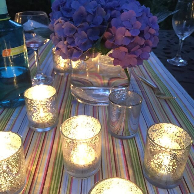 Did some outdoor entertaining this weekend. Turn a casual drop by visit into a night under the stars with a few fabulous touches&mdash; like adding a table runner to the table, votive candles, flowers from the yard, and bistro lights. Usually we woul
