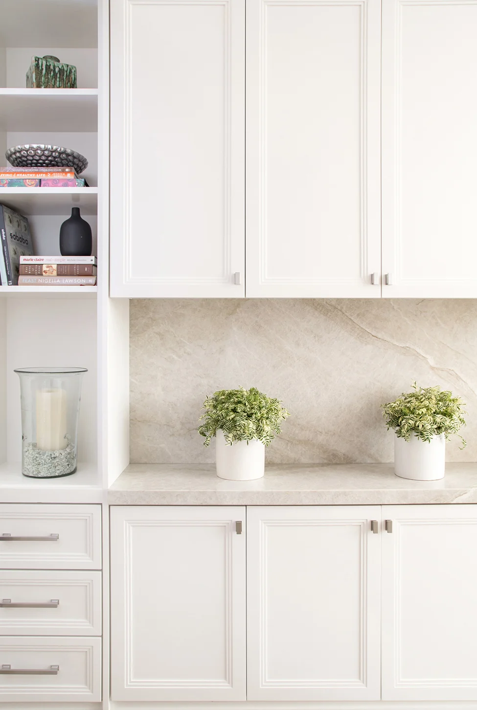 Classic built in white cabinets with marble countertop and backsplash and open shelving