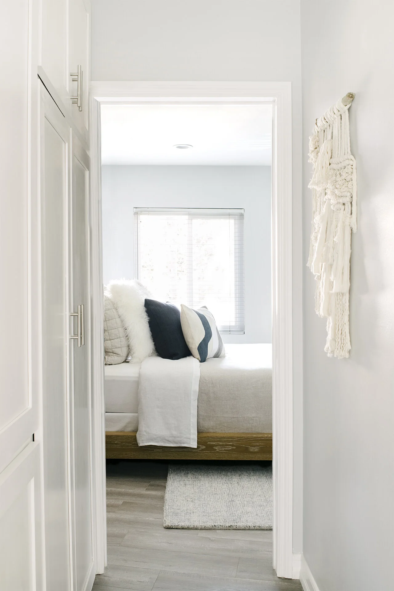 Beachy bedroom style with West Elm pillows and accessories