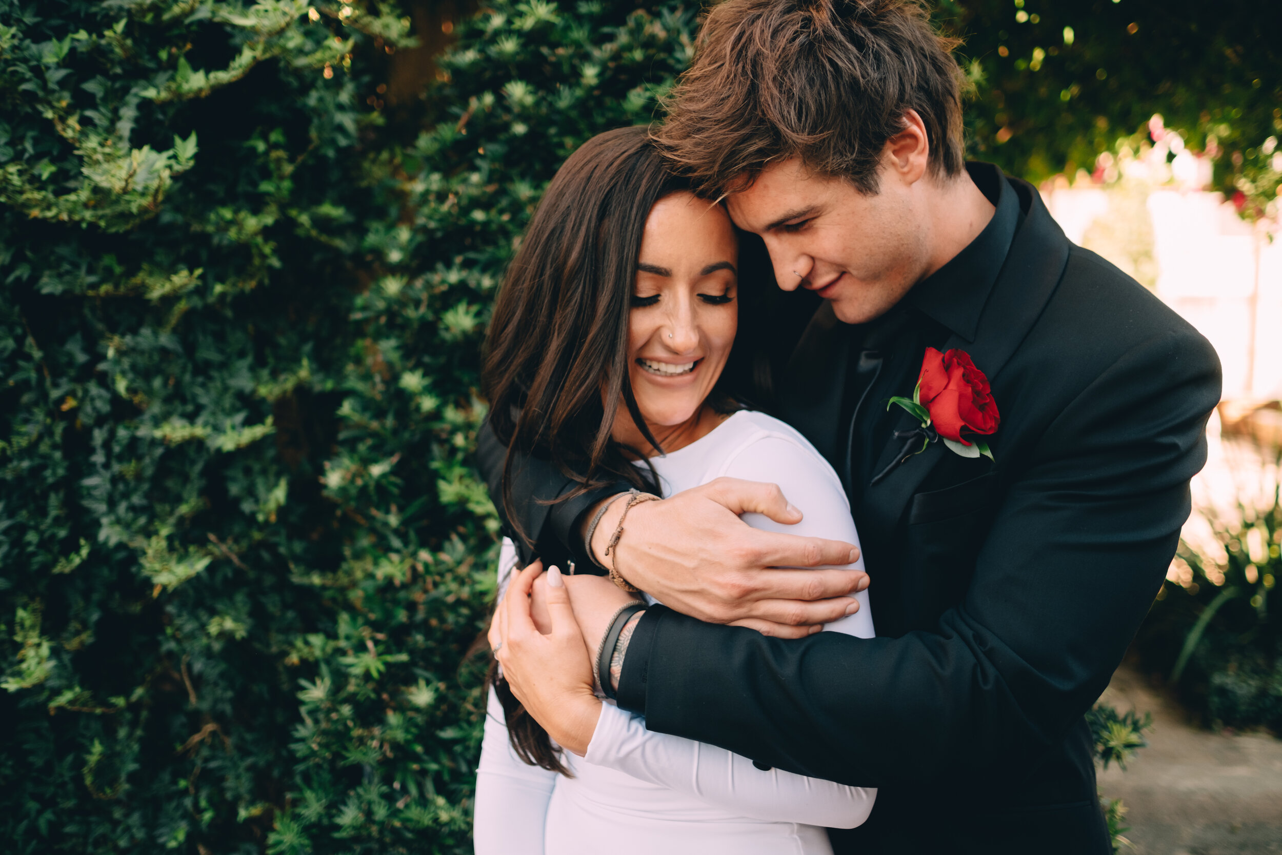 Bride & Groom hugging after elopement ceremony at Race + Religious