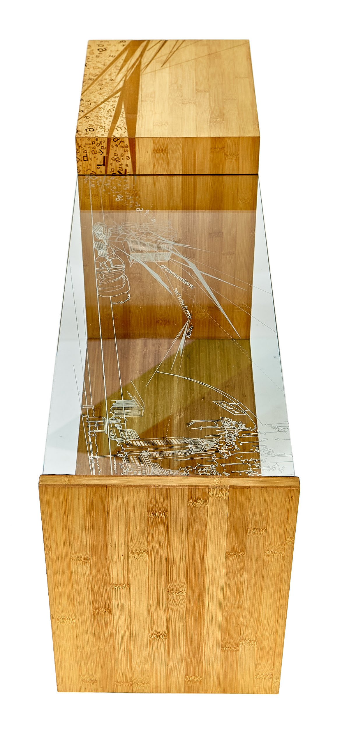 A wooden pedestal with engraved cityscape and text on a glass top.
