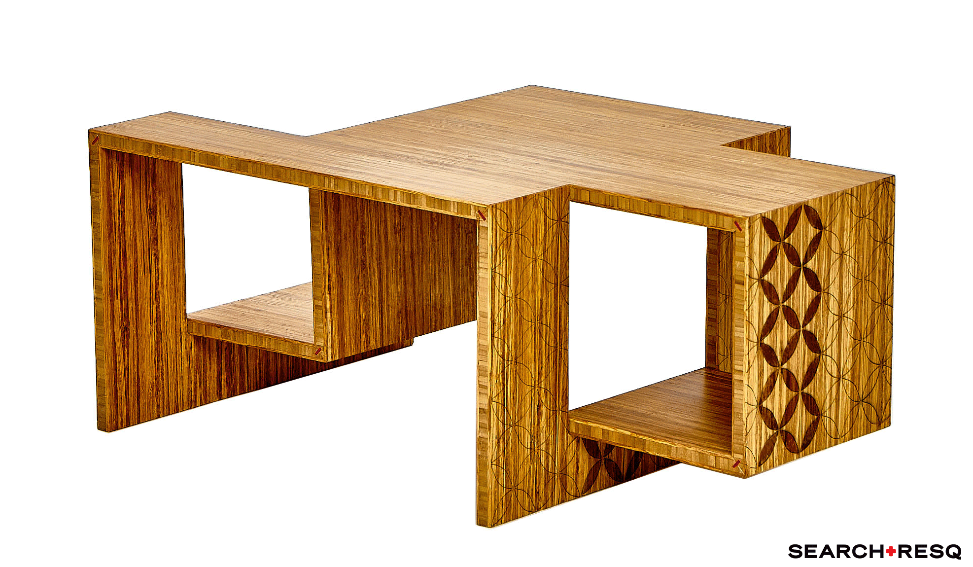 A wooden coffee table with two open shelves, one on each side, made of striped wood with geometric patterned edge on one side.
