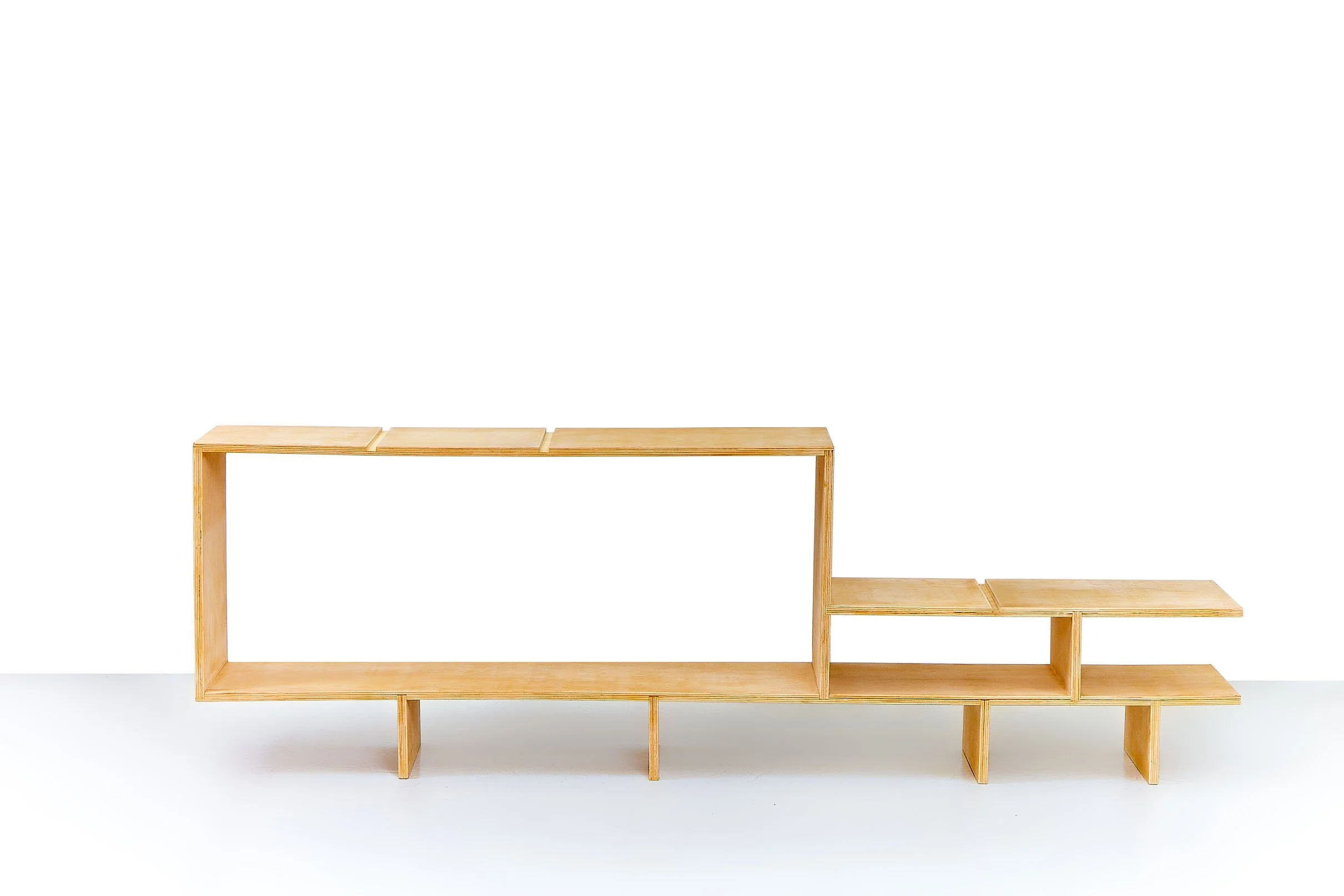 Minimalist wooden staircase with multiple steps, isolated on a white background.