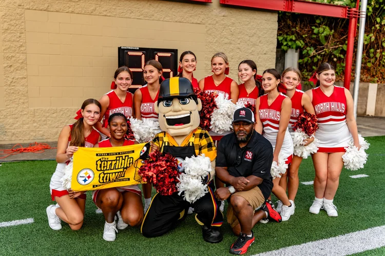 Steely McBeam with North Hills cheerleaders at the Pittsburgh Steelers High School Football Showcase