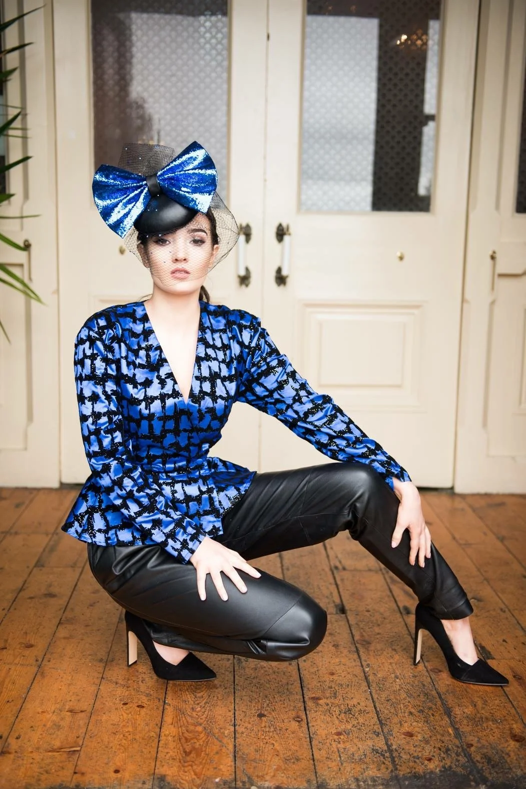 Power house showstopper blue glitter bow with black leather