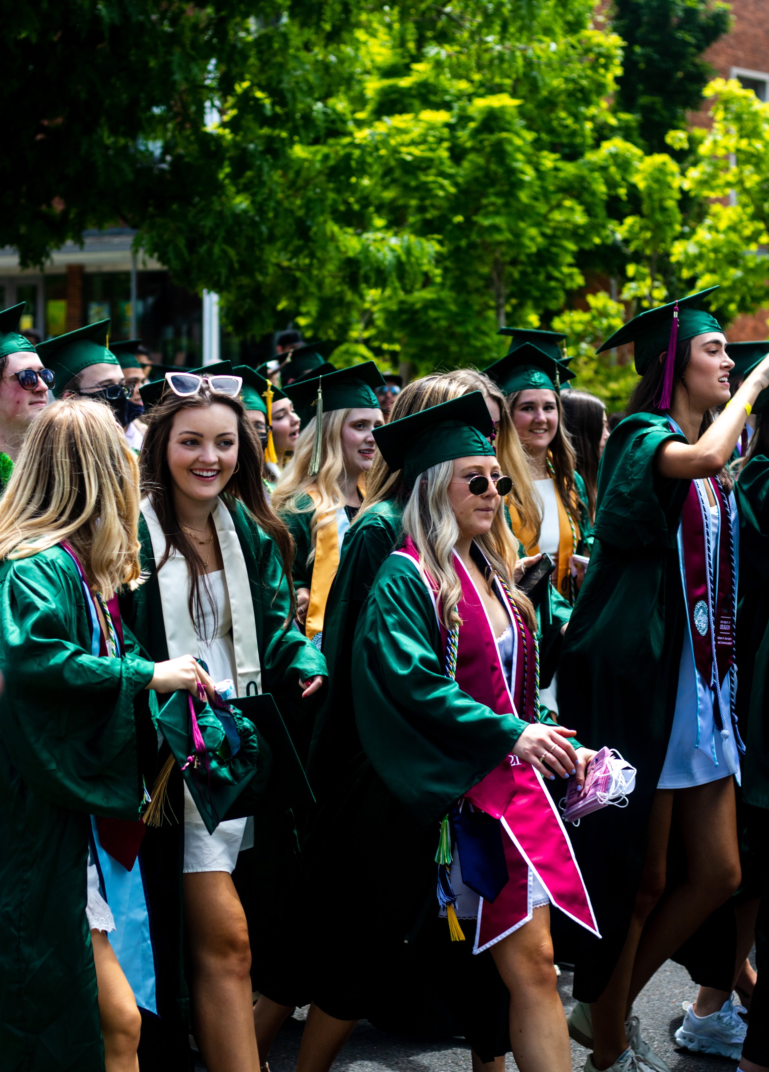 University of Oregon graduates walk towards the commencement stage during the traditional Grad Parade. After a full academic year of online school, the class of 2021 participated in the University of Oregon's traditional Grad Parade on June 12, 2021