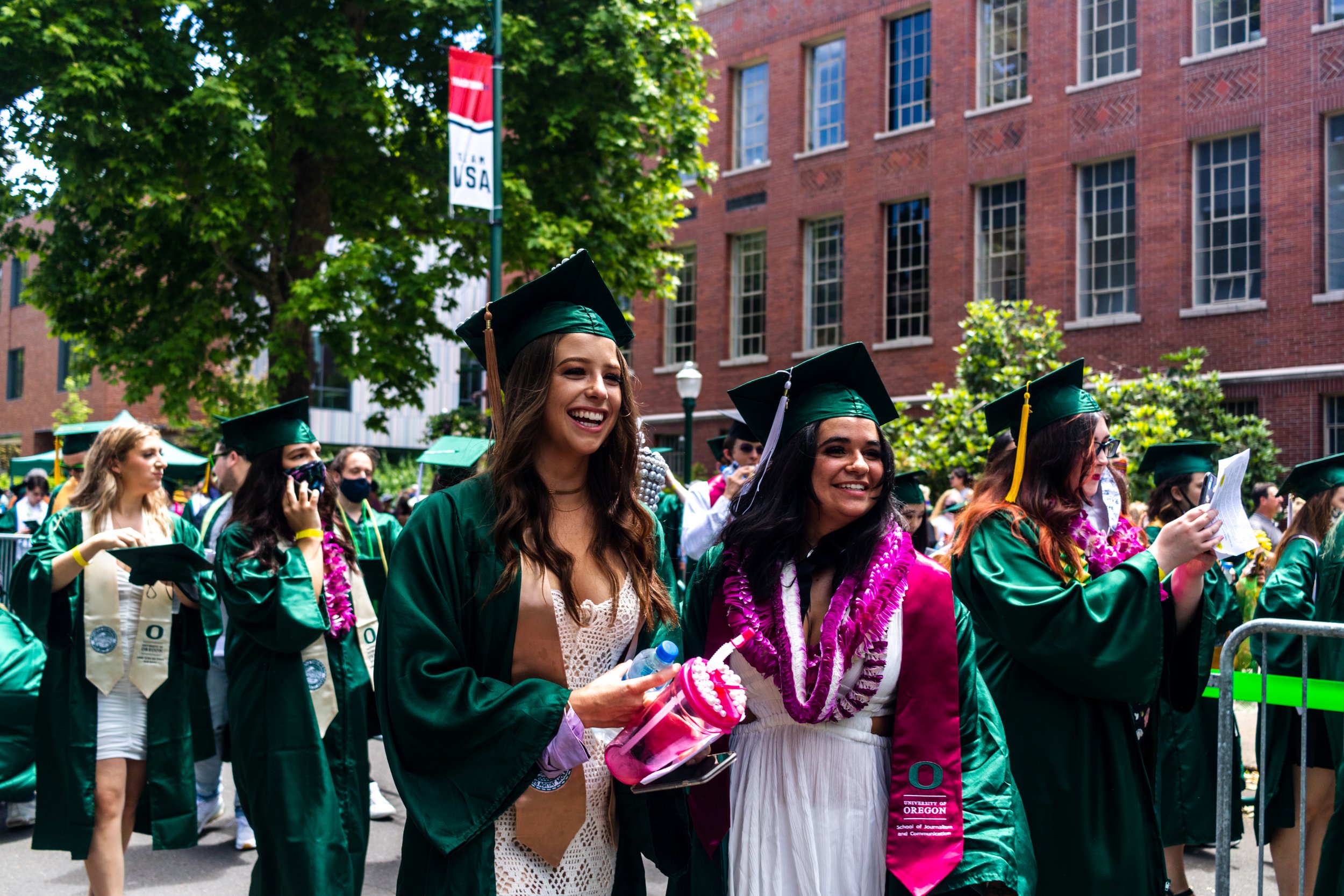 University of Oregon graduates walk towards the commencement stage during the traditional Grad Parade. After a full academic year of online school, the class of 2021 participated in the University of Oregon's traditional Grad Parade on June 12, 2021