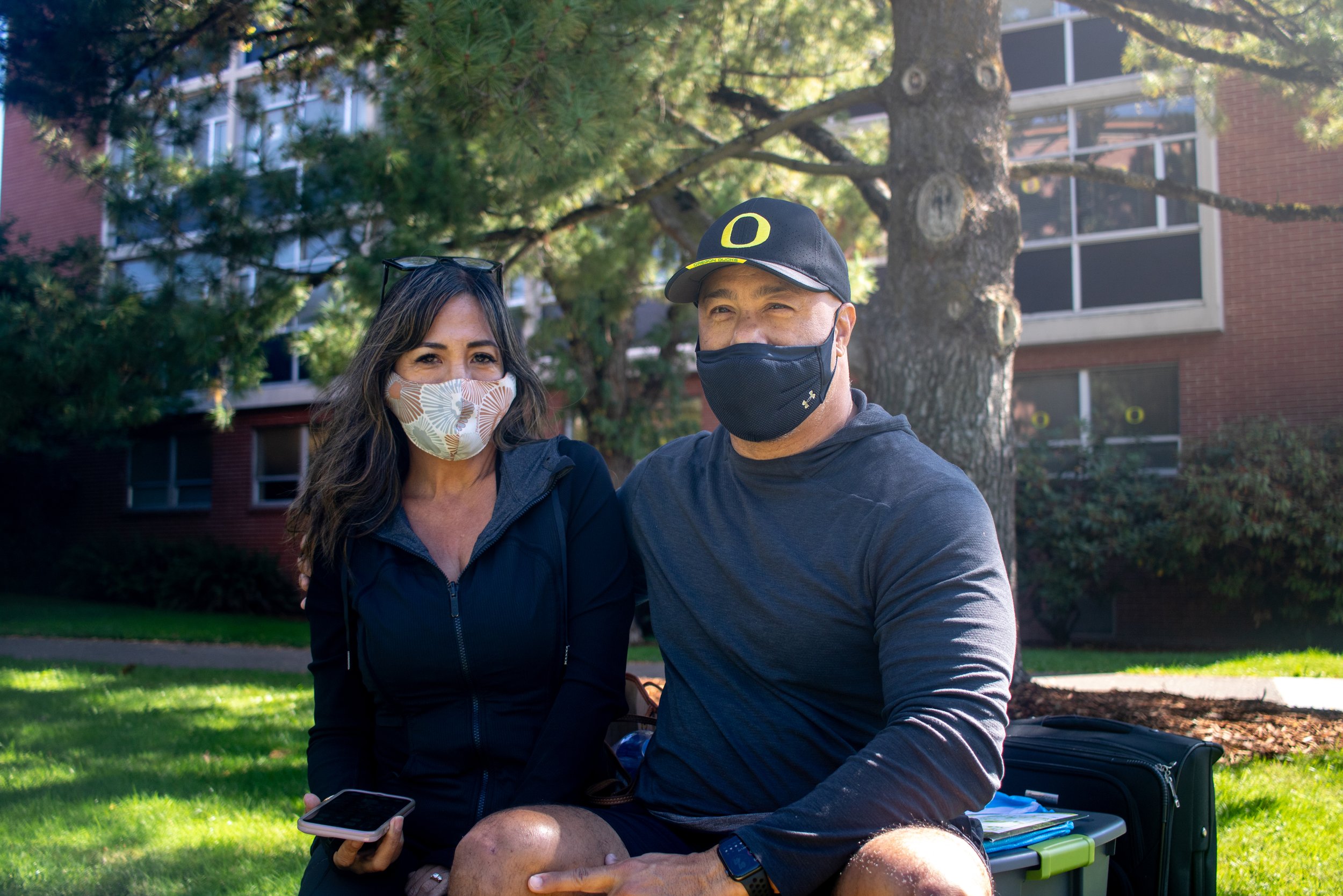 Jackie (left) and Ernest (right) Brezale wait to move in with their son on September 23, 2021. University of Oregon students are preparing to resume in person activities across campus during fall term. (Will Geschke/Emerald)