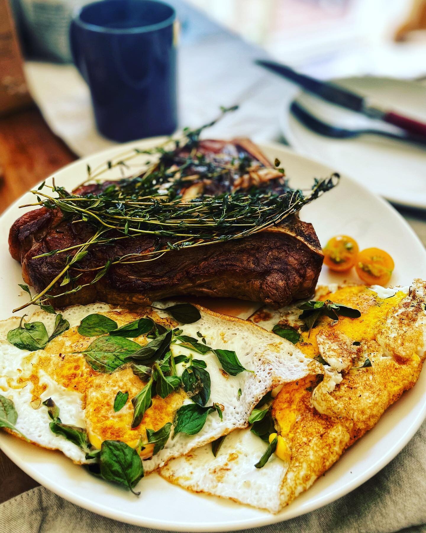 Happy Friday everyone! 

.

A bit of a treat, but we did some pasture raised t-bone steak with local farm fresh eggs this morning, topped with home grown oregano, thyme, and one single golden tomato (the first to ripen this season lol!).

.

We proba