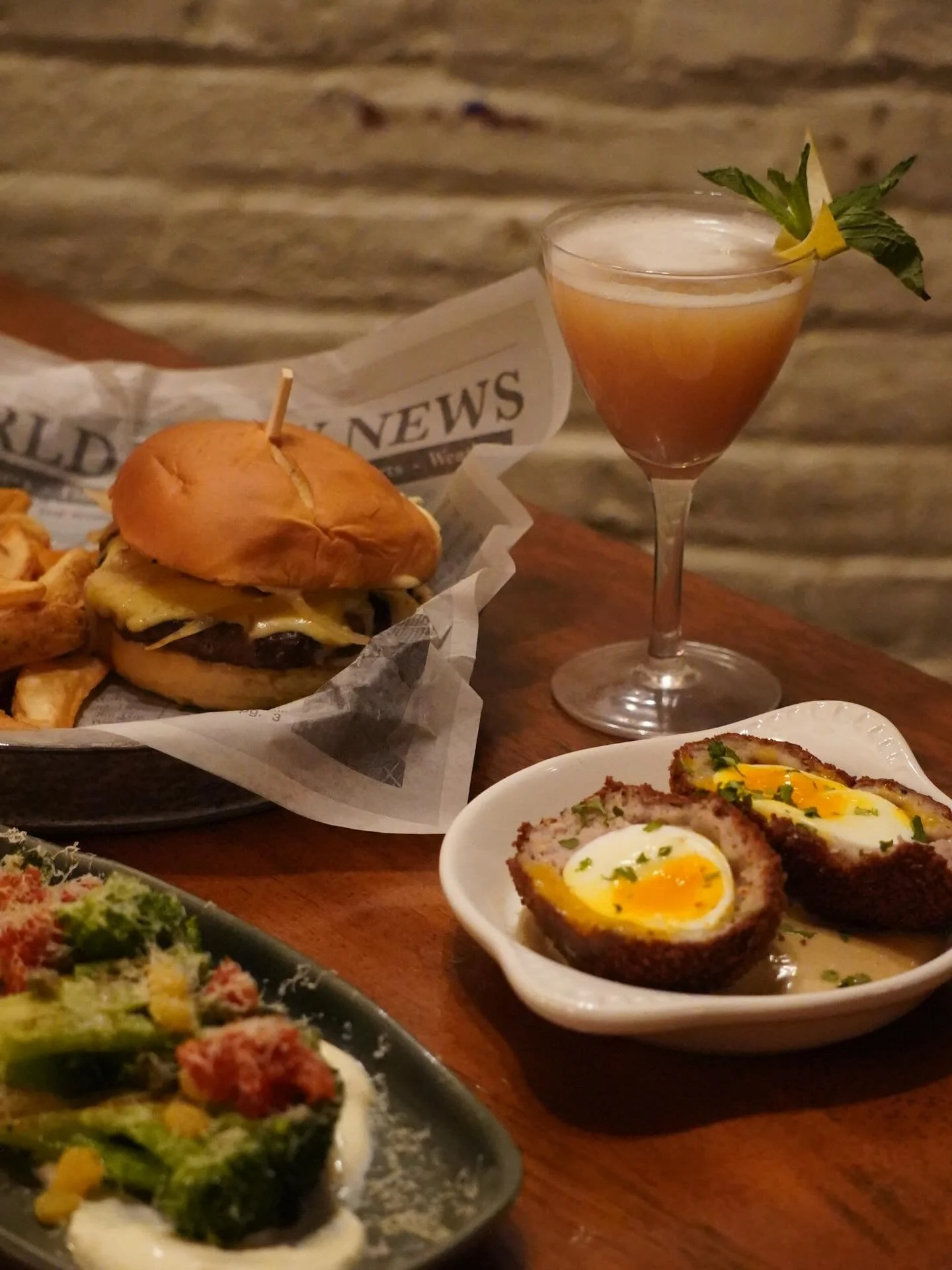 WEEKEND SPECIALS ✨

Scotch Egg 🥚
&bull;Soft Boiled Egg 
&bull;Coated in Banger Sausage and Bread Crumbs
&bull;Paired with a Guinness Stout Aioli 

Charred Broccoli 🥦 
&bull;Fresh Broccoli 
&bull;Spicy Yogurt Sauce 
&bull;Pickled Raisins and Pickled