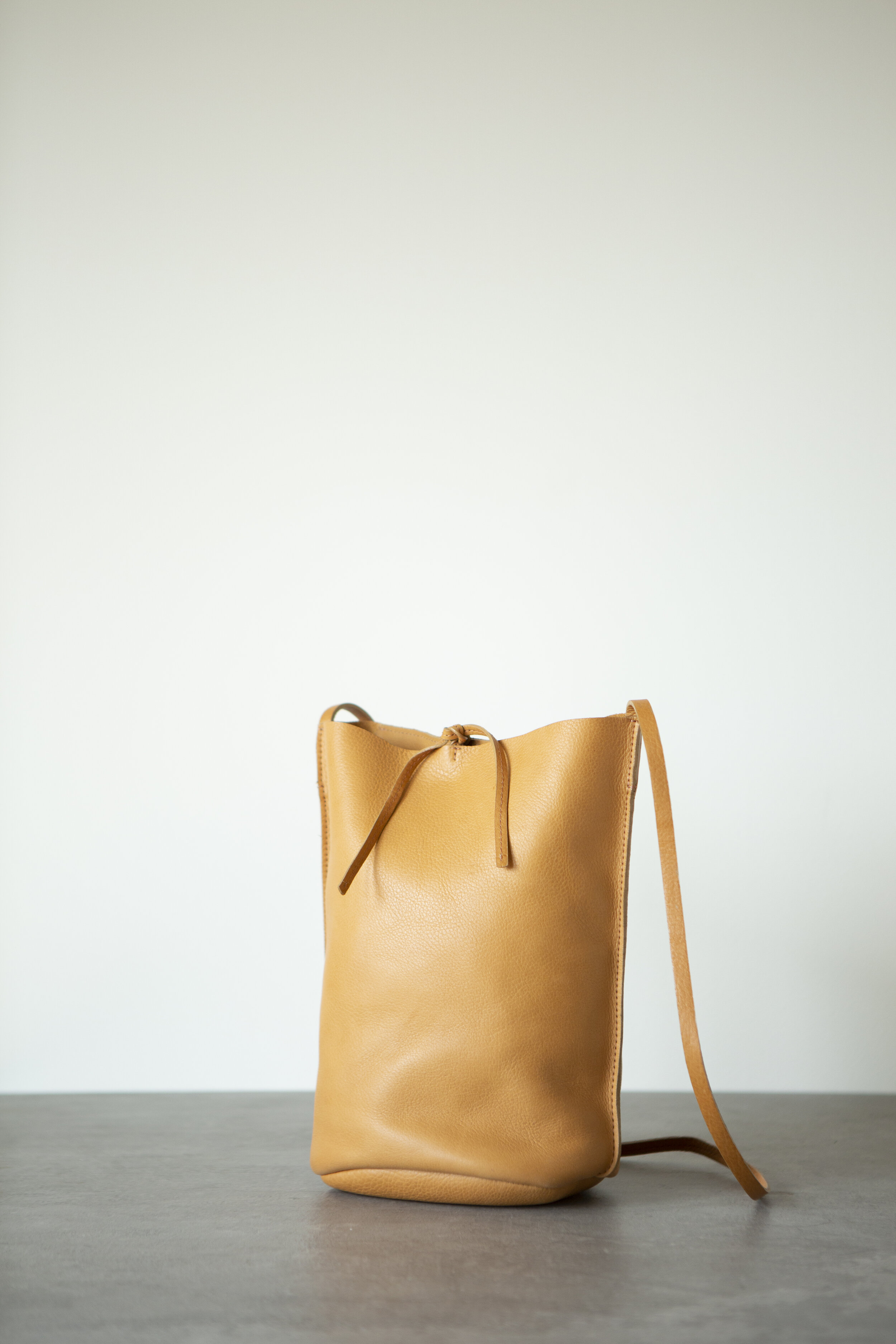 NURAXI by Teresa Robinson — Crossbody Bucket Bag - Vegetable Tanned Camel