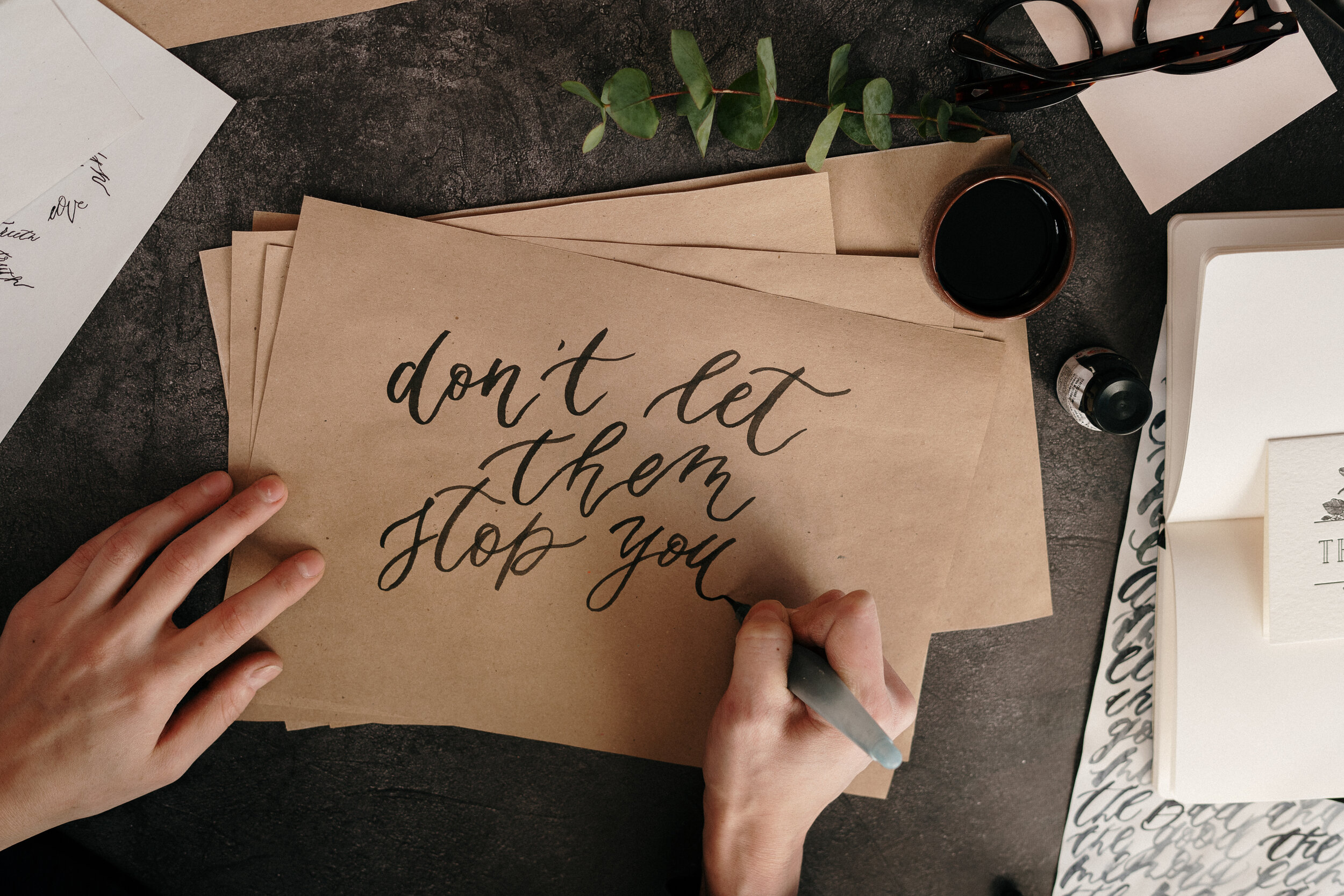 Canva - Person Writing on Brown Envelopes.jpg