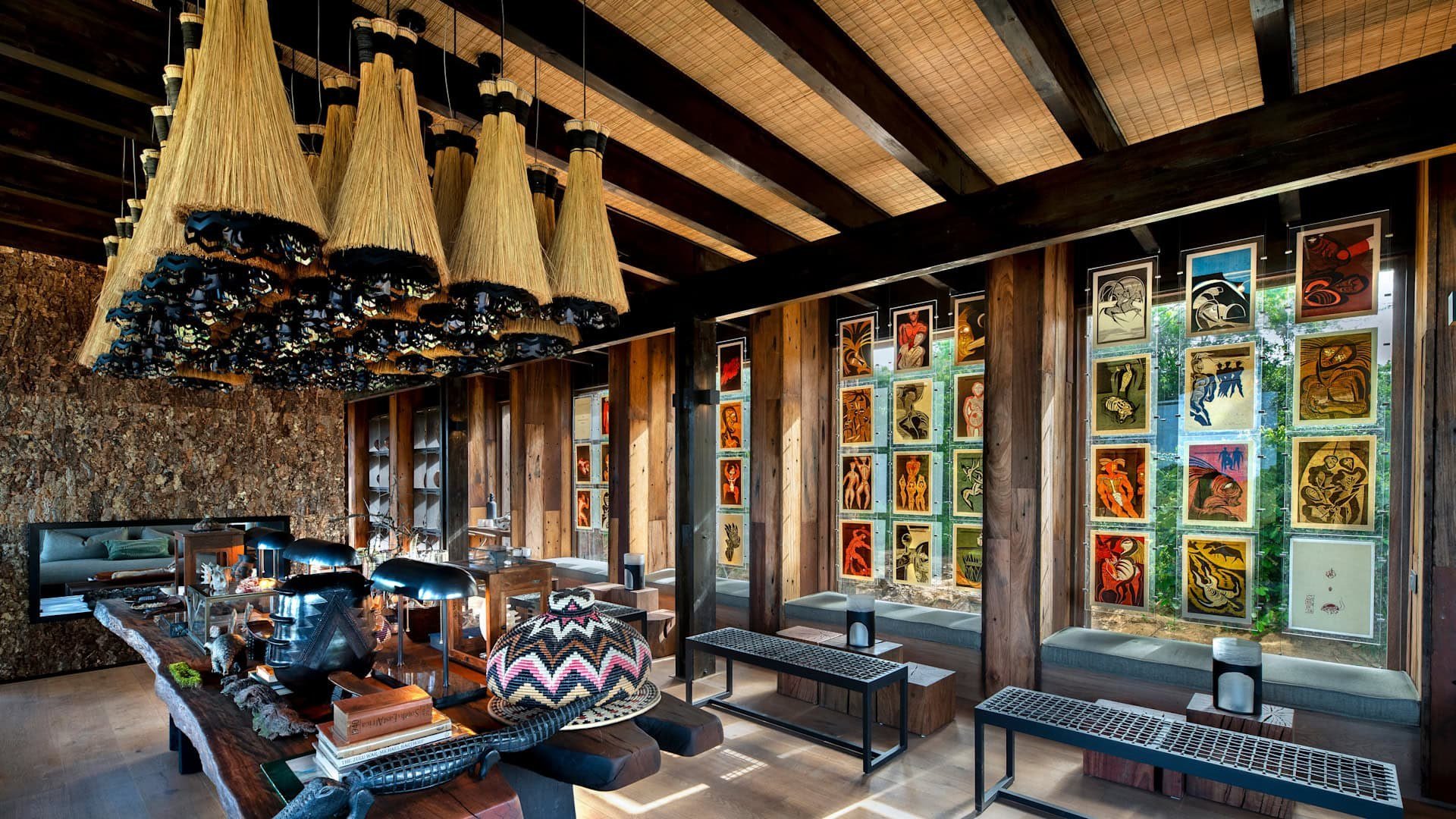 Library — Completed build
A layered gathering space

The photograph shows the table, pendant cluster, window artwork and fireplace in the completed library. Pendant detailing, seating and table styling differ from the visualisation.