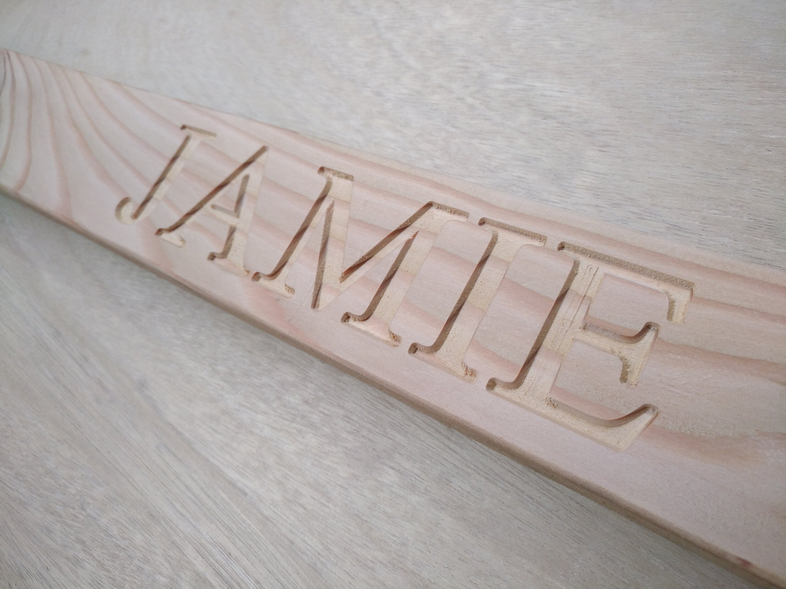 CNC routed larch name plate Jamie-min.jpg