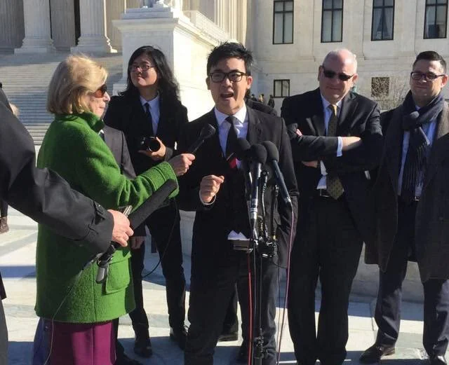 Simon Tam being interviewed by Nina Totenburg in front of the Supreme Court of the United States in 2017, after oral arguments.