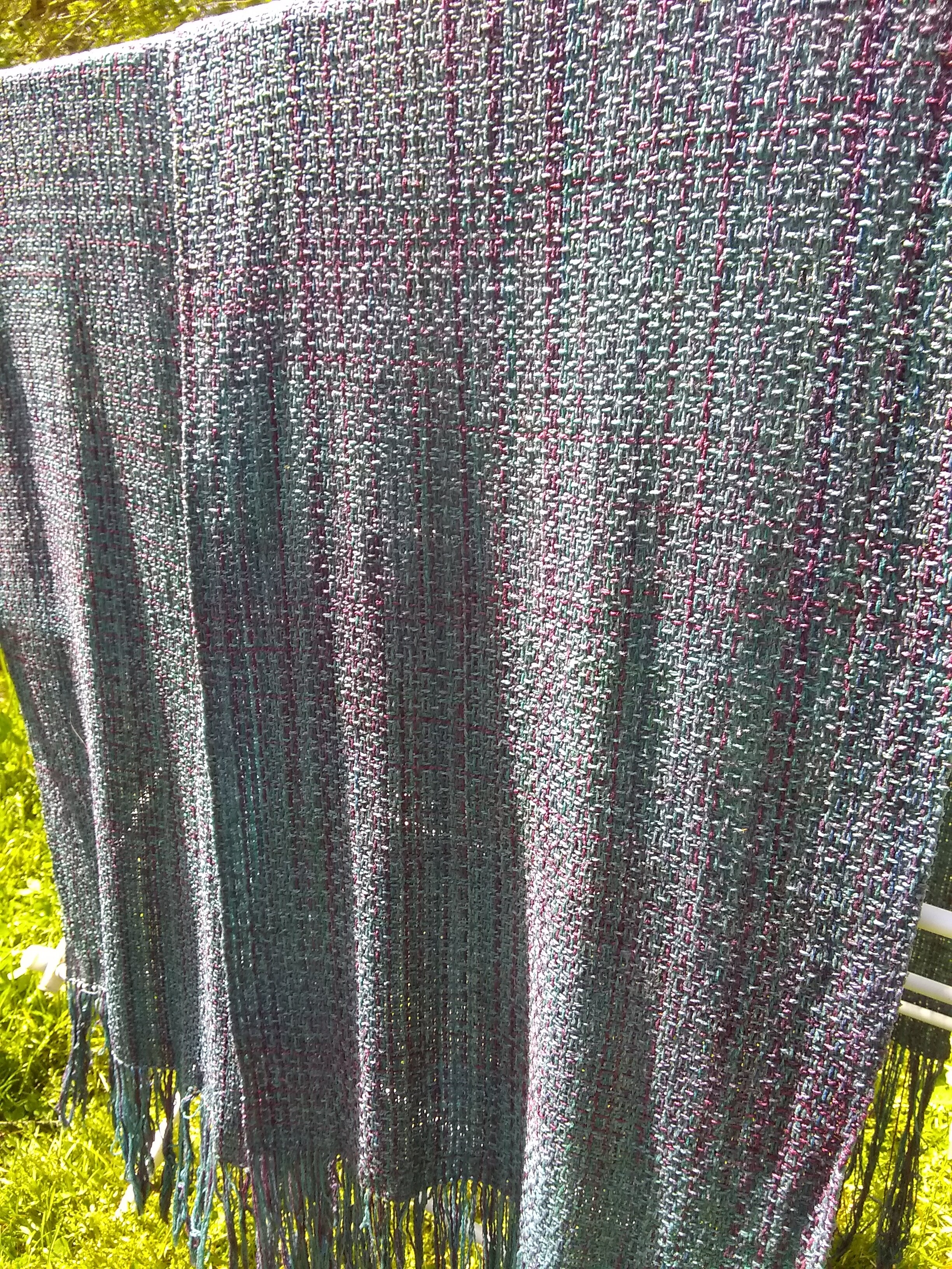 The piece will be wet finished (washed) and hung to dry.