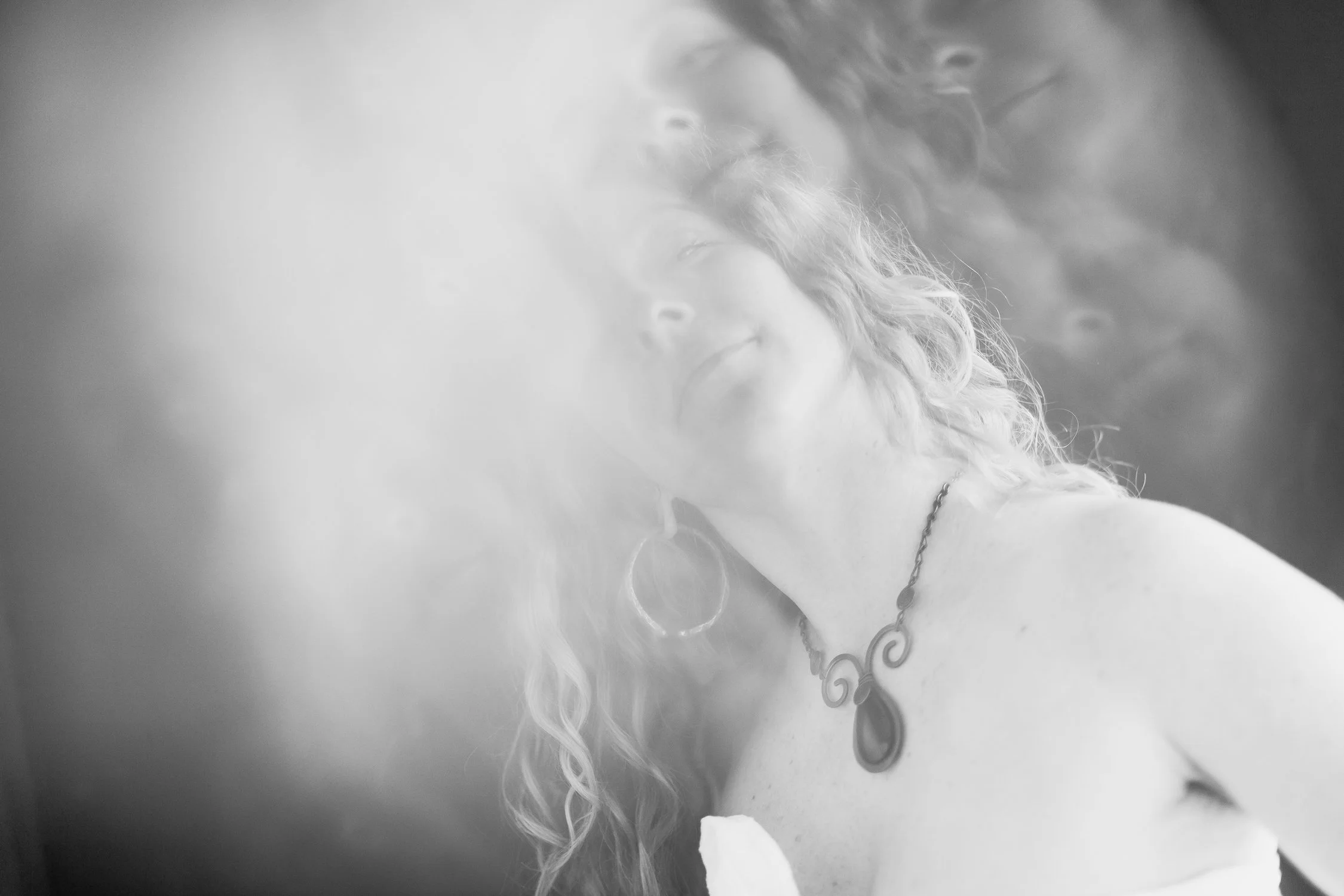 black and white portrait of Meghan taken through a prism creating a kaleidoscope effect