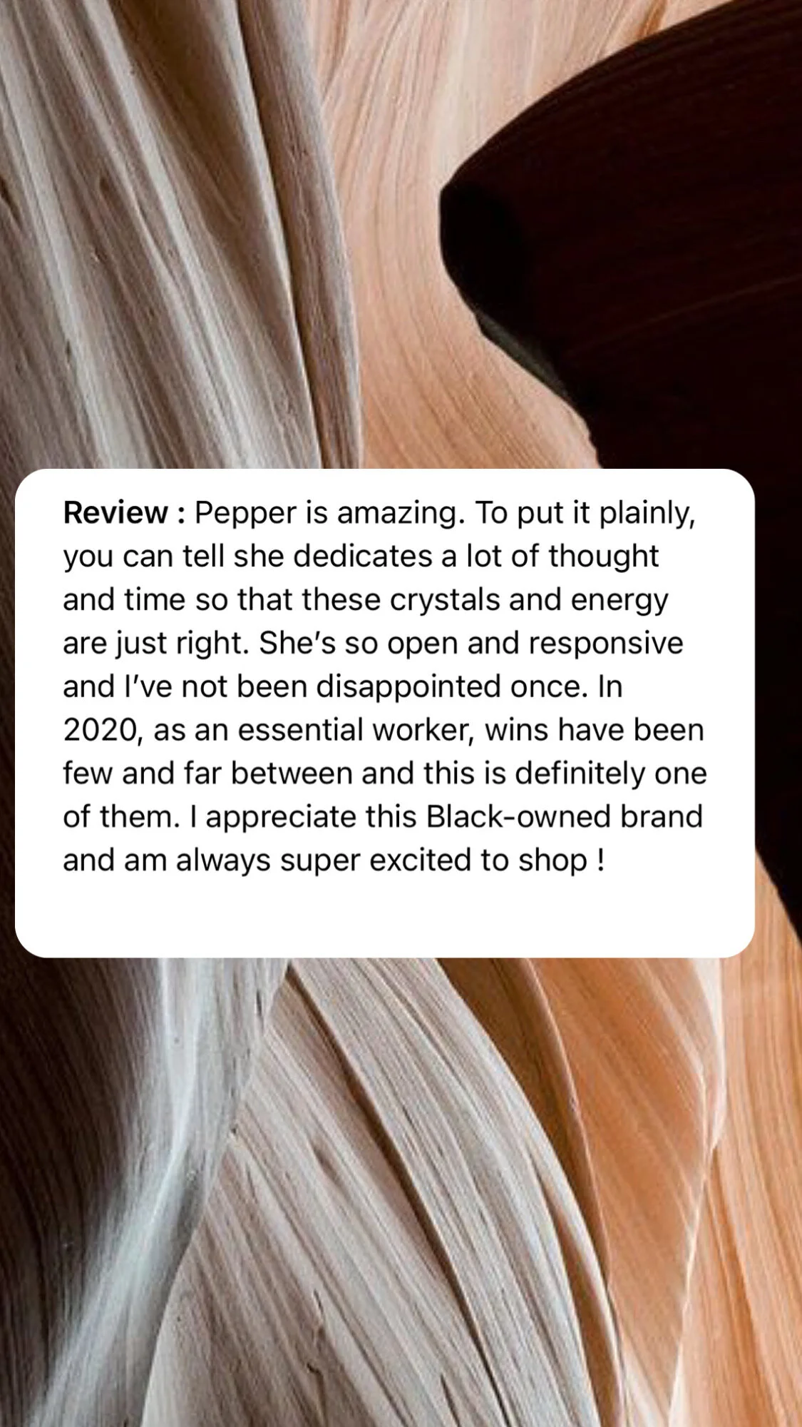 Close-up of natural wooden textures with swirling patterns and a small black object in the top right corner.