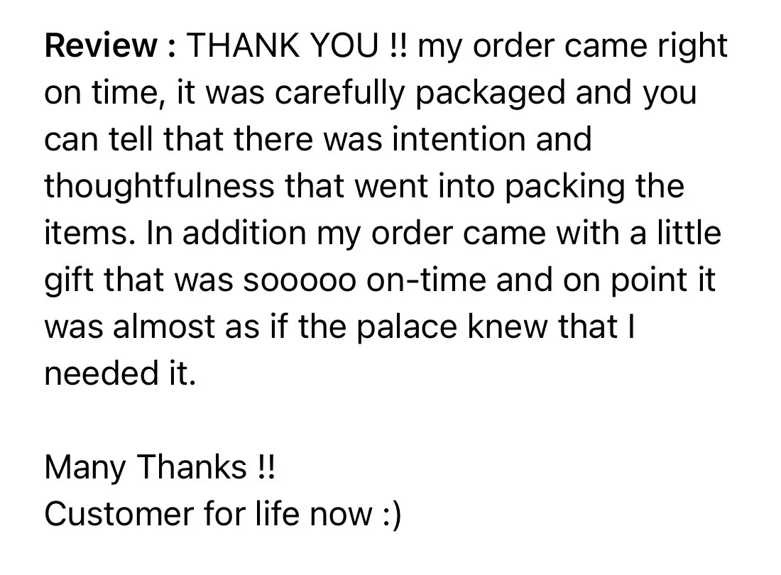 Screenshot of a customer review praising the timely delivery and thoughtful packaging of their order, along with a small gift included.