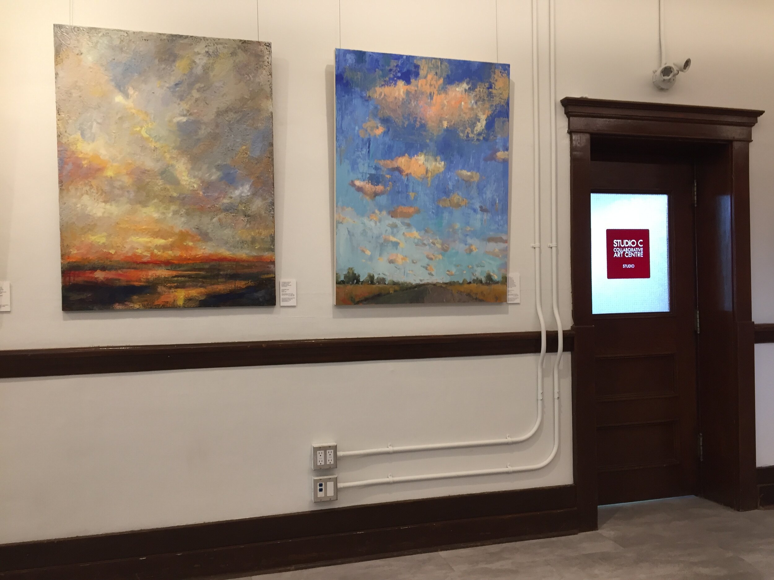  Under my Skies Show at cSPACE, Calgary, Alberta  Collection of the artist. On the left—We Will Rise Again. On the right— Pink Sky Syndrome. 