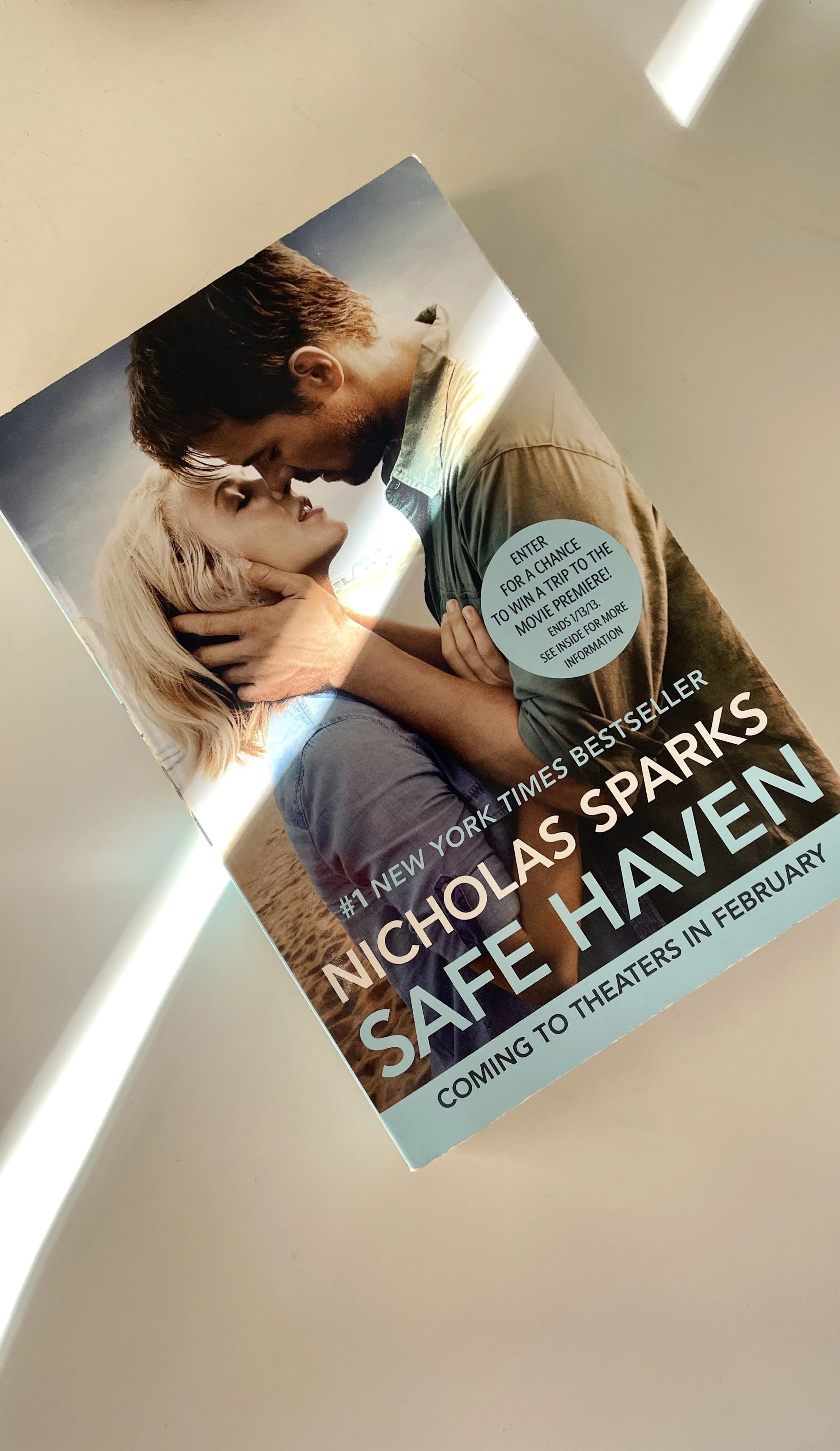 Young couple about to kiss on a beach