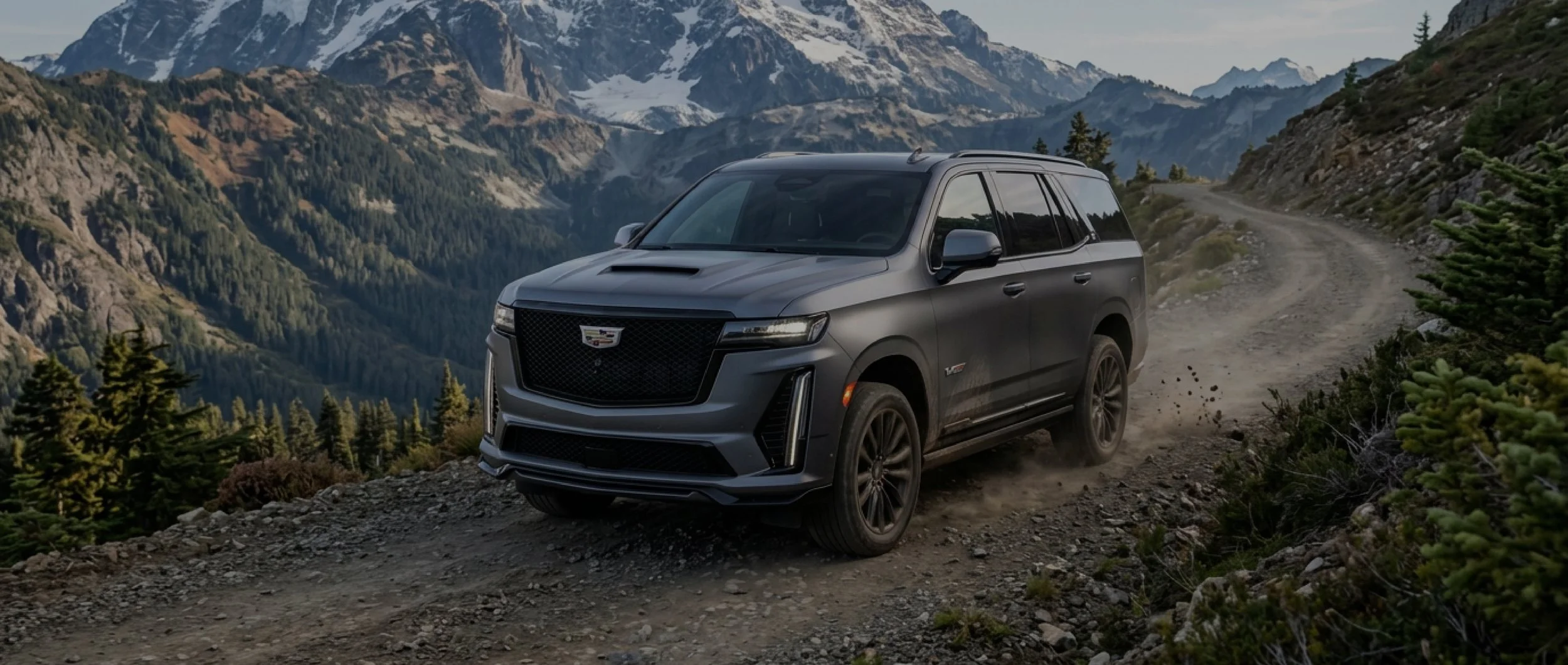Black SUV with paint protection film driving down a rocky mountain trail, illustrating rock chip and road hazard protection from EIGHTYNINE VWS in Little Elm, TX