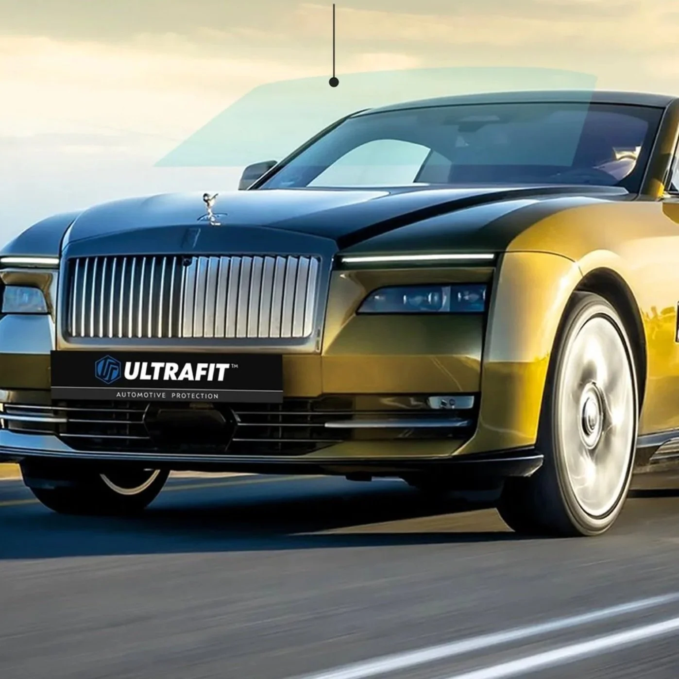 A luxury car with a two-tone black and yellow paint job is driving on a road. It features a prominent chrome grille, sleek headlights, and a small hood ornament. A black ULTRAFIT automotive protection license plate is attached to the front.