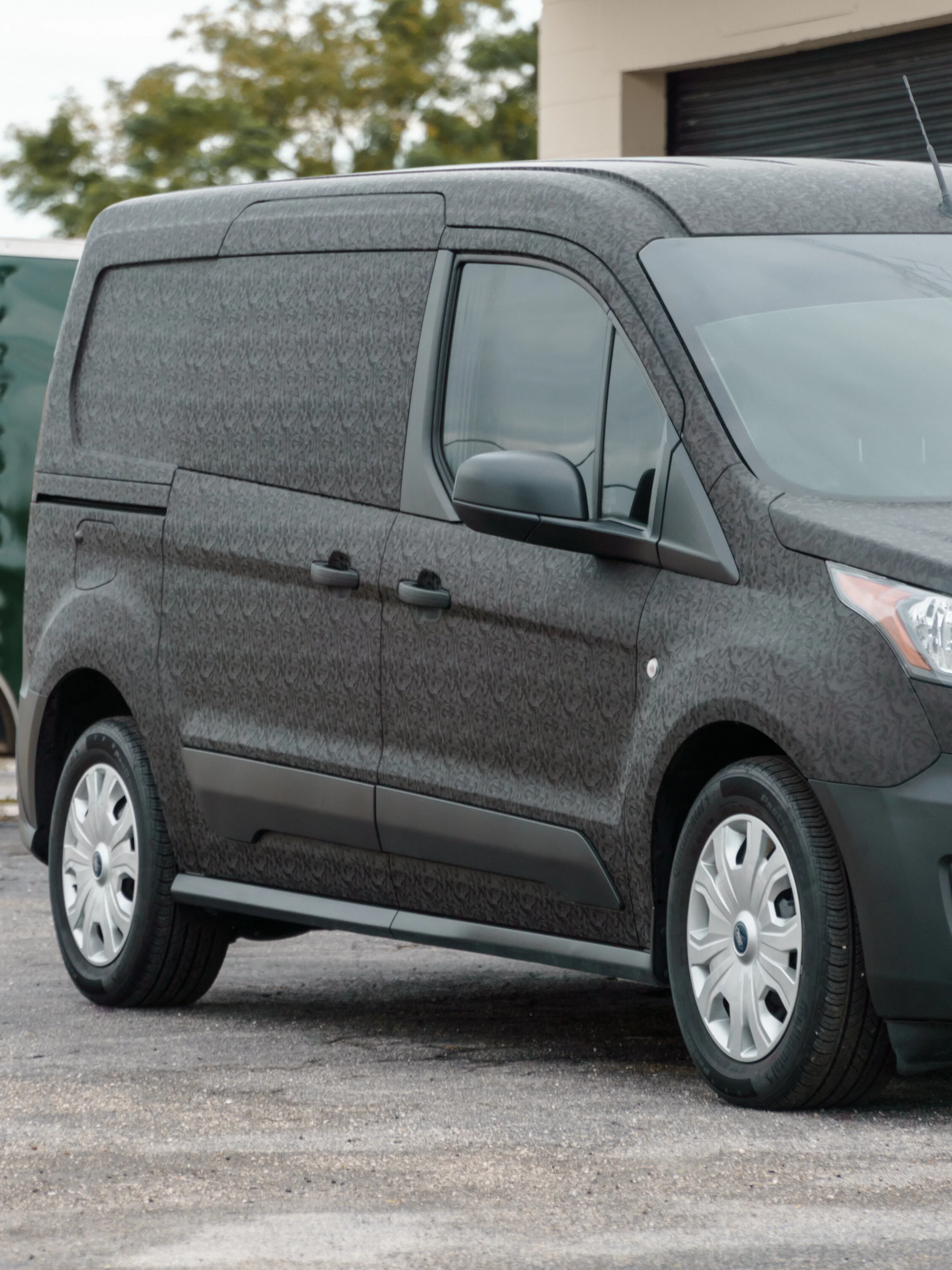 Gray Ford Transit Connect commercial cargo van, ready for custom fleet graphics and business branding wraps by EIGHTYNINE VWS in Little Elm, TX