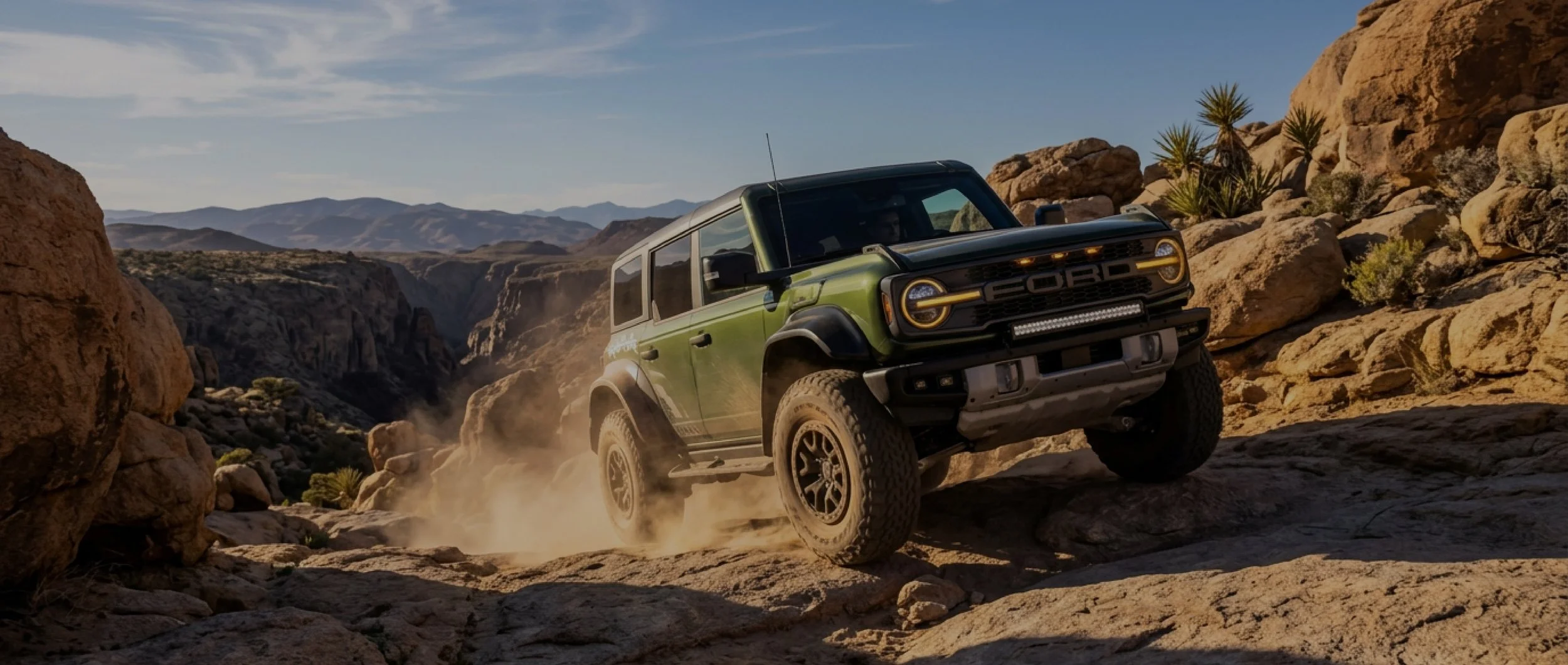 Olive green off-road SUV with color change paint protection film driving through the Texas desert, showcasing EIGHTYNINE VWS's PPF installation services in Little Elm, TX