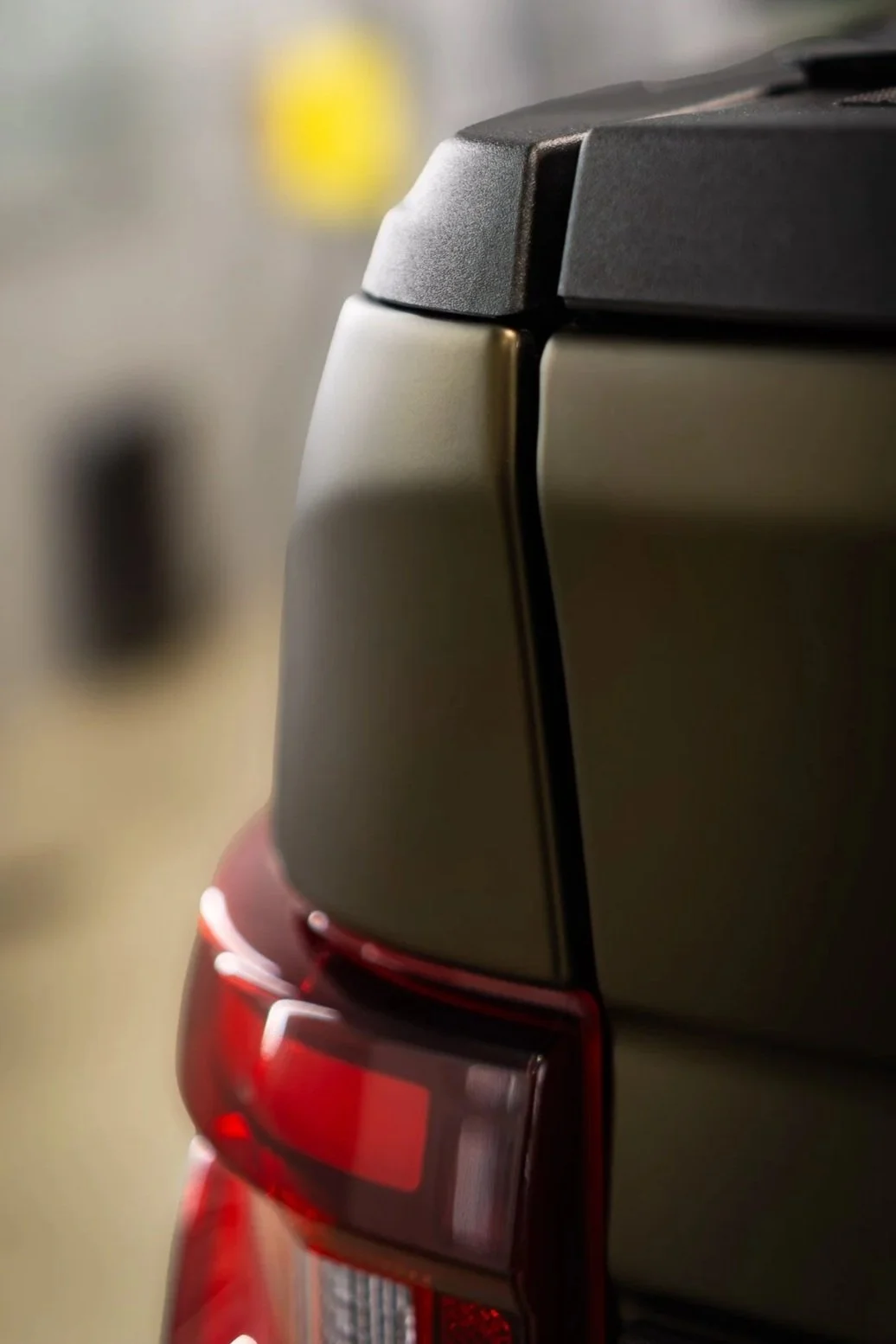 Close-up of a side mirror on a red vehicle protected with clear paint protection film, showing a glossy, bubble-free finish - EIGHTYNINE VWS PPF installation in Little Elm, TX