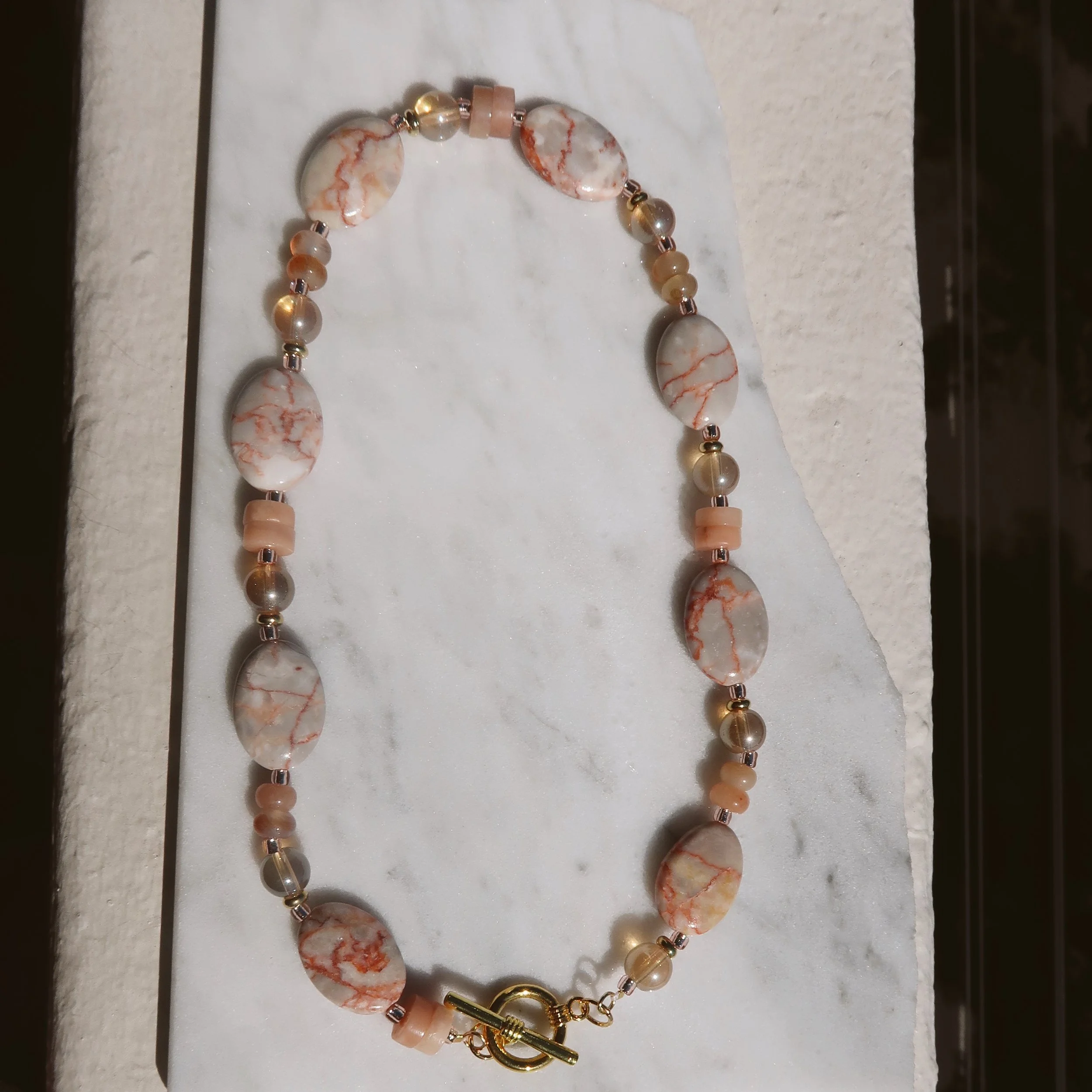 SunsetRedlineMarbleFullLengthonMarble.JPG