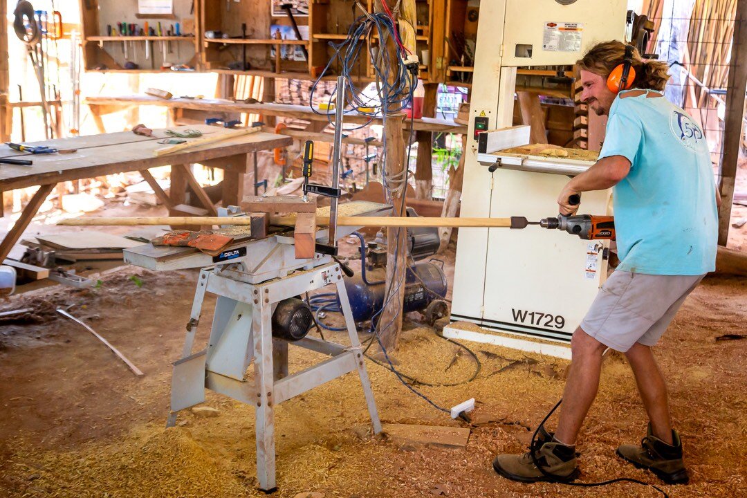 Shipbuilder_using_the_trunnel_or_tree_nail_maker.jpg