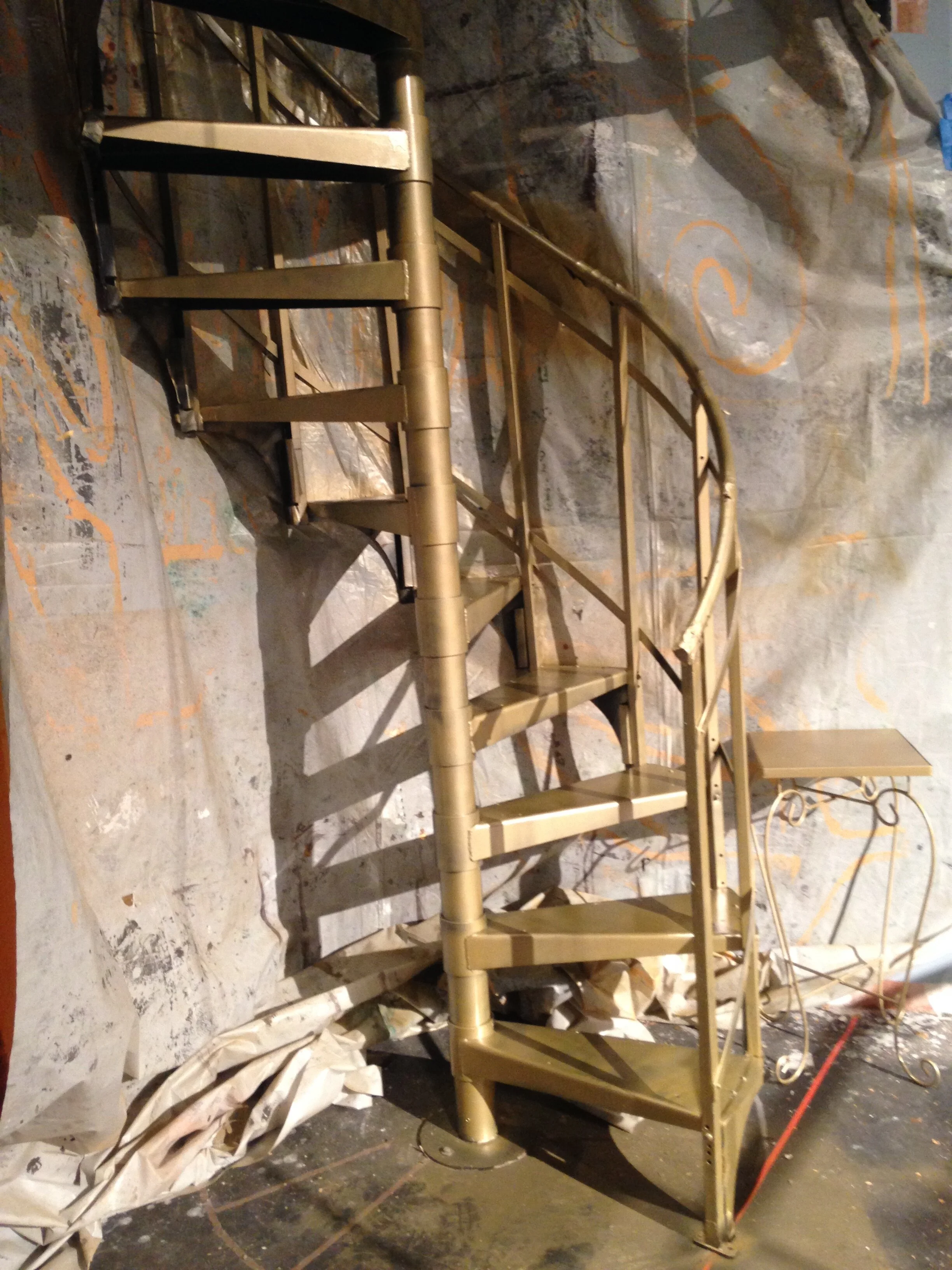Gold painted spiral staircase