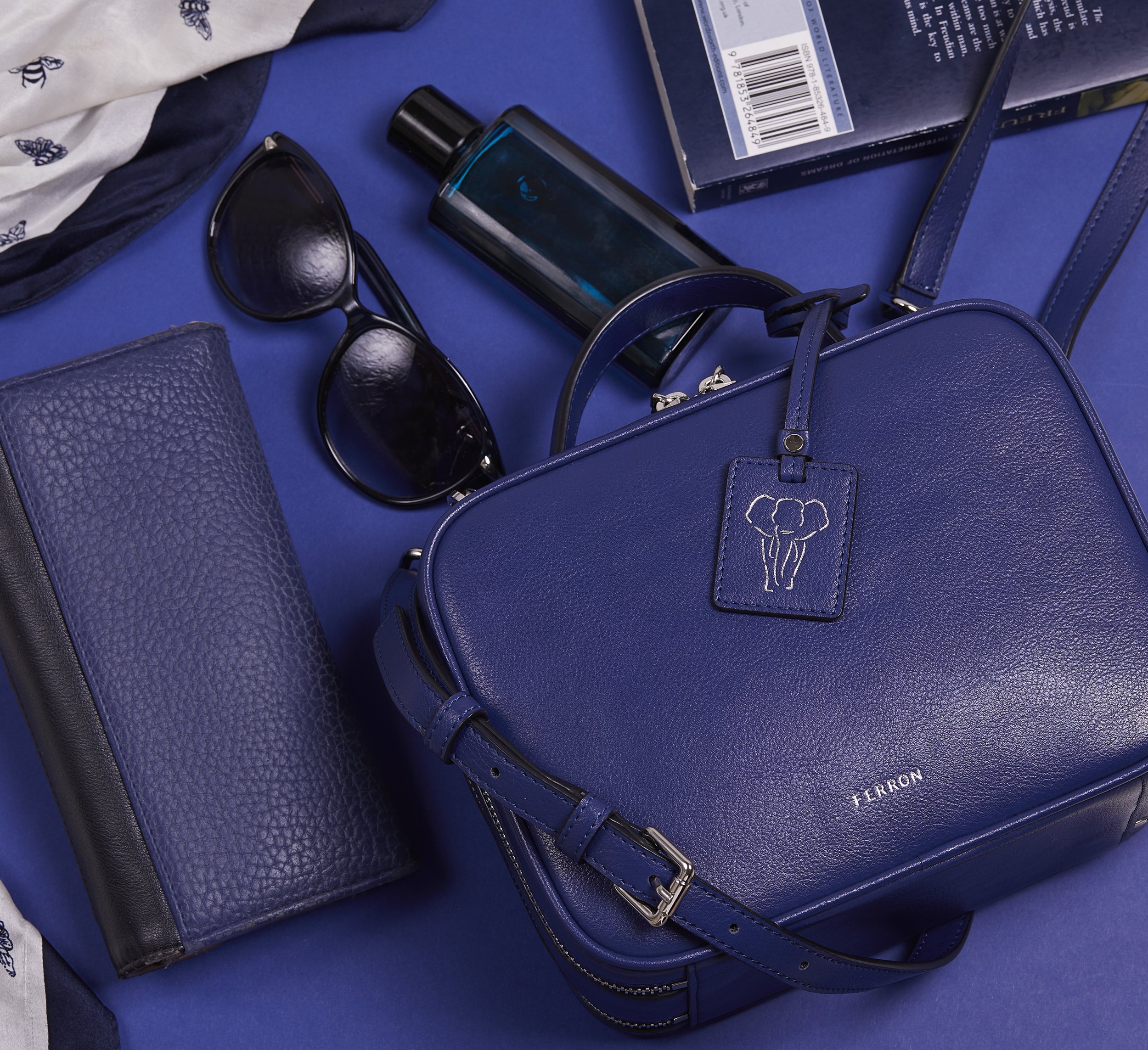 Handbag advertisement commercial photography, lifestyle studio shoot showing "what is inside my bag" still life photo by victoria cook photography  