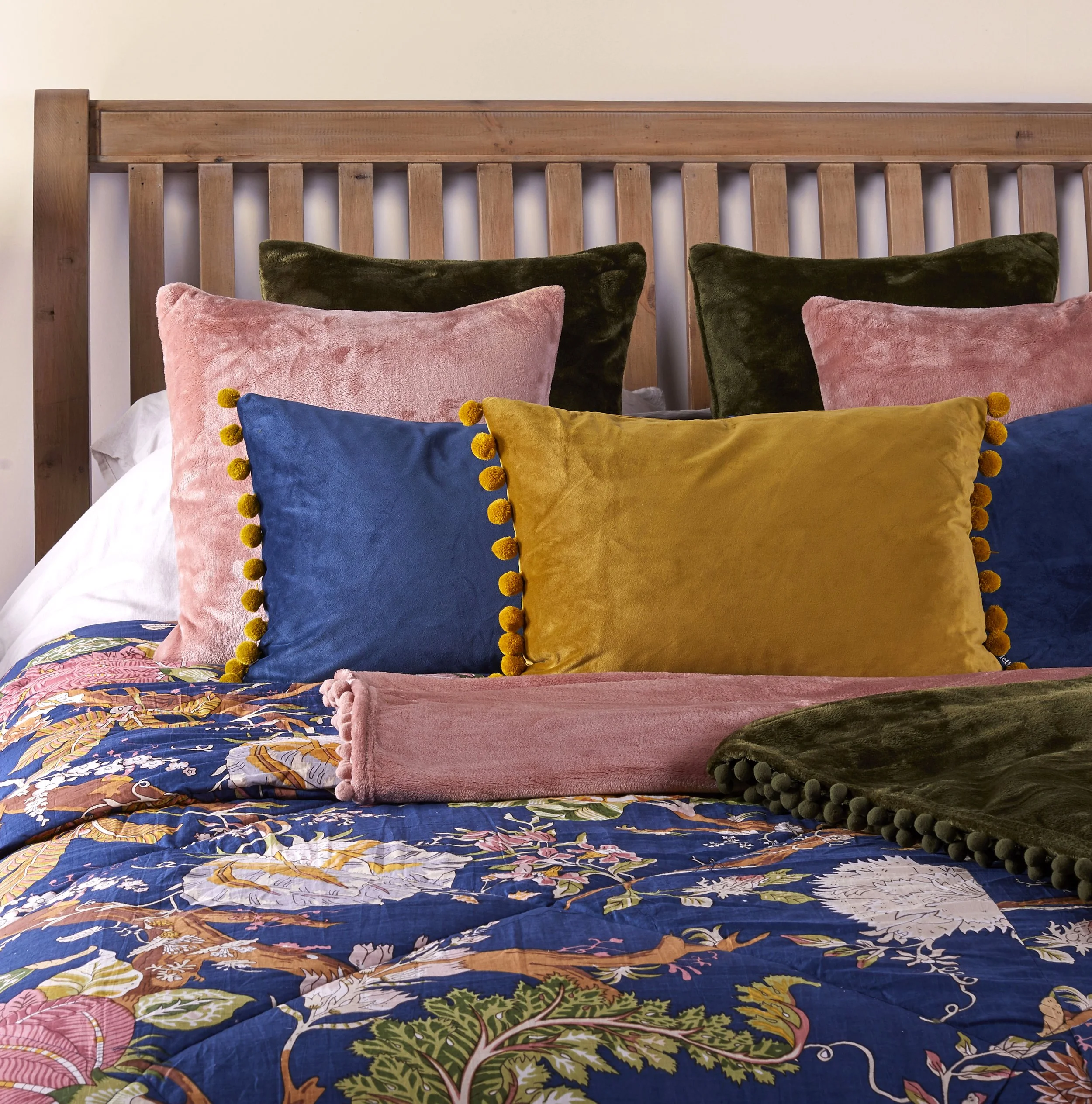 Lifestyle advert commercial photography of bedding and furniture, independent brands photography. Bed styling with throws and cushions styled and shot by victoria cook photography  