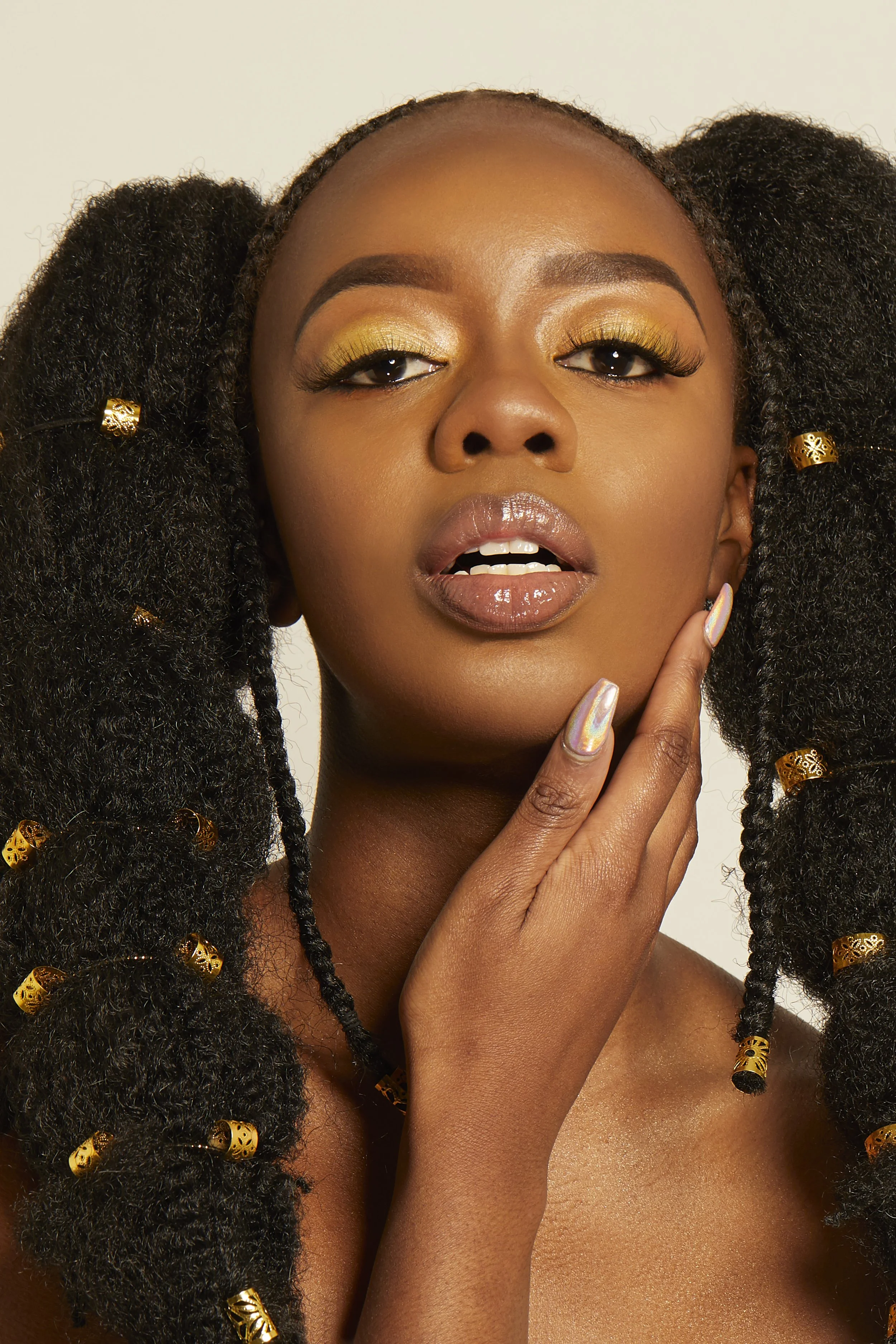 Beauty magazine photography styling afro weaves, studio lighting, flawless makeup photograph by victoria cook photography