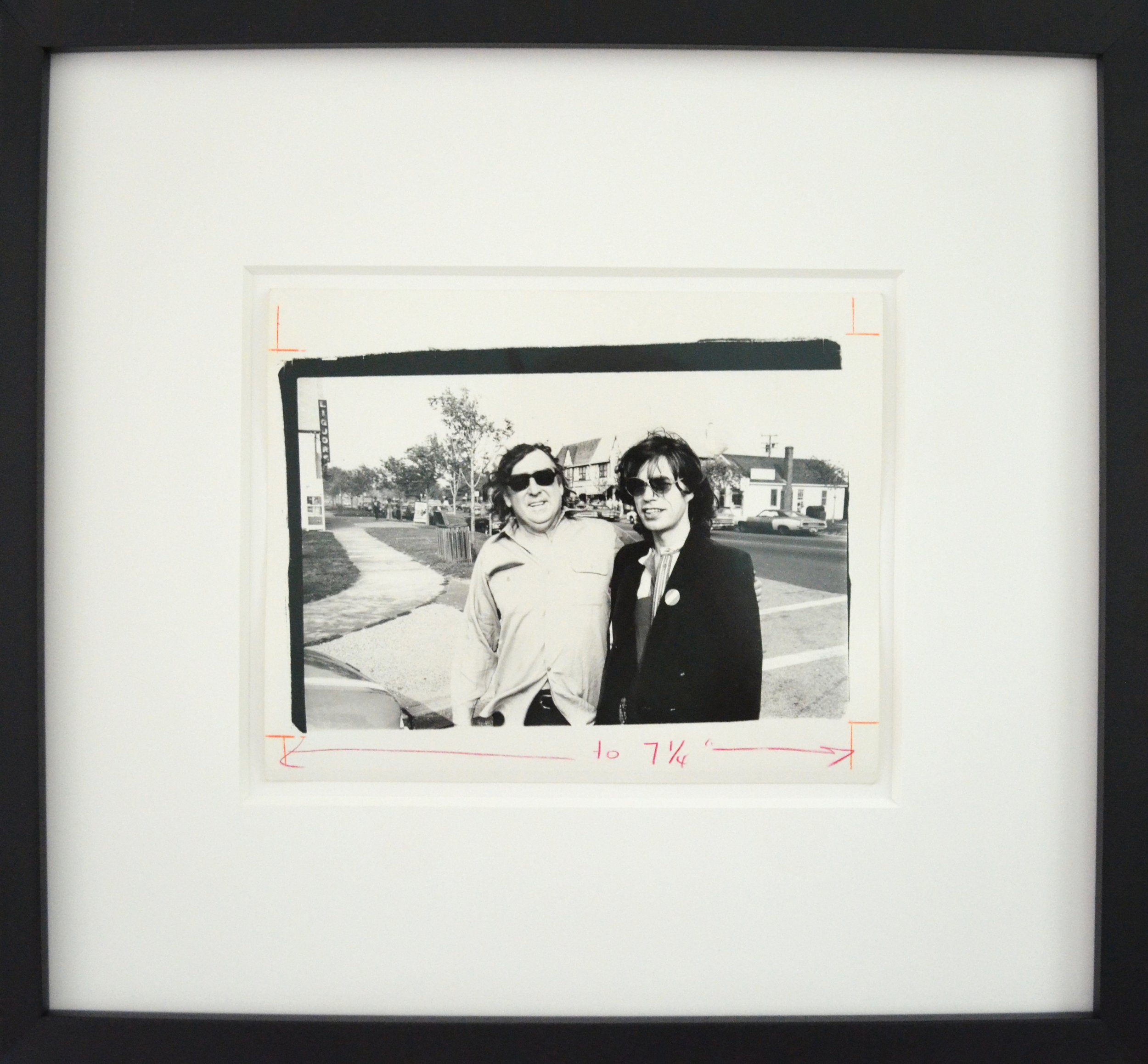 Andy Warhol’s unique gelatin silver print, 'Mick Jagger and Terry Southern', shown here framed.