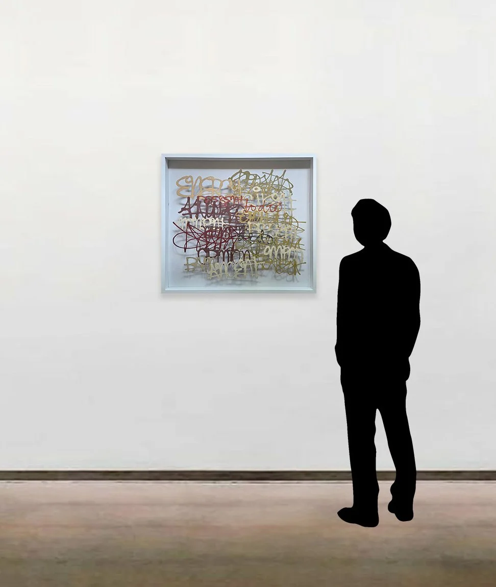 Miriam Londoño’s handmade paper work, 'Invasive Words #2', shown here framed alongside a six-foot-tall figure.