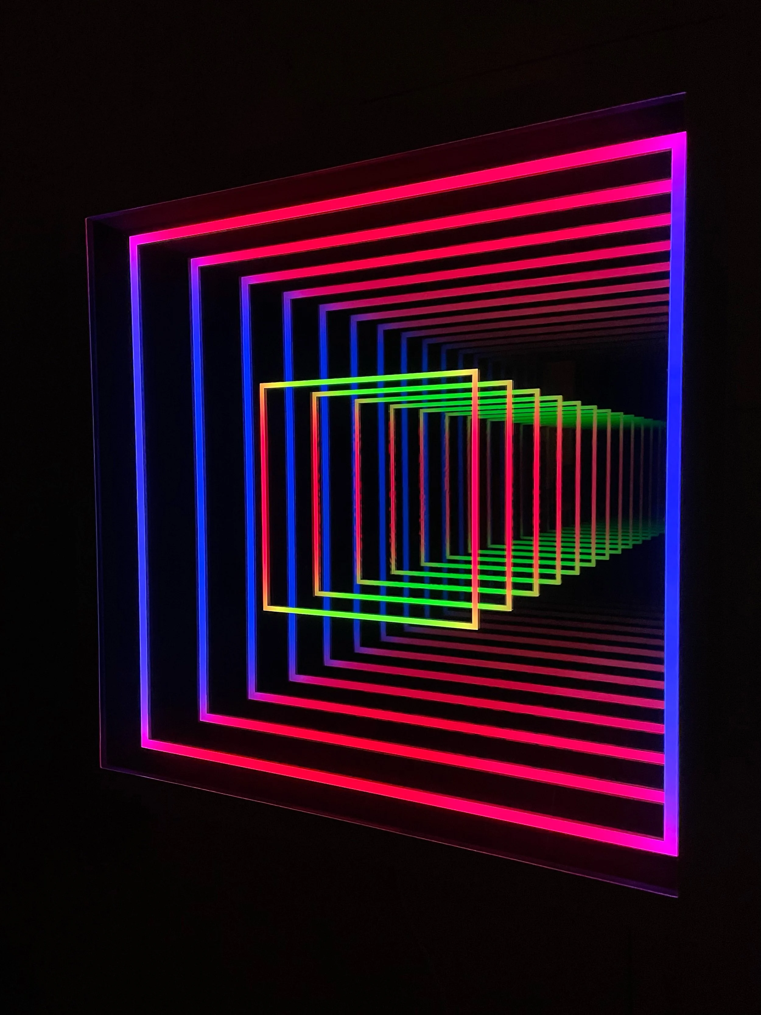 An alternate angle of Chul Hyun Ahn’s 2024 work, 'Two Squares'. The work is shown here with its changing LED lights emitting different colors.