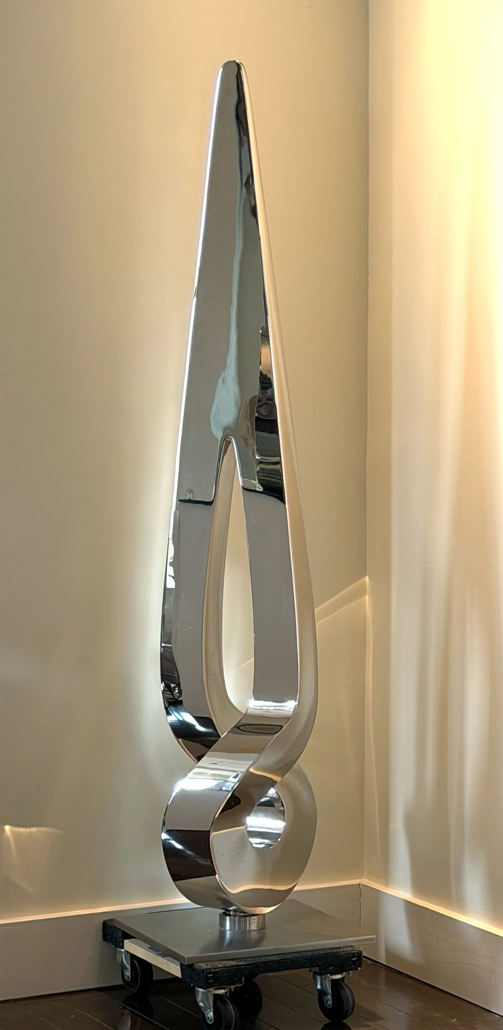 Propeller by Tarik Currimbhoy, an L316 Marine-grade stainless steel kinetic sculpture, shown here on a moveable base.