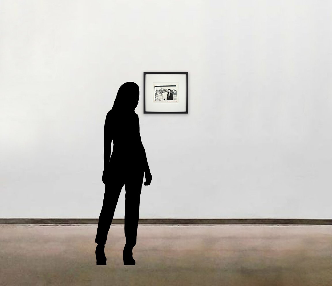 Andy Warhol’s unique gelatin silver print, 'Mick Jagger and Terry Southern', shown here framed and alongside a six-foot figure for scale.