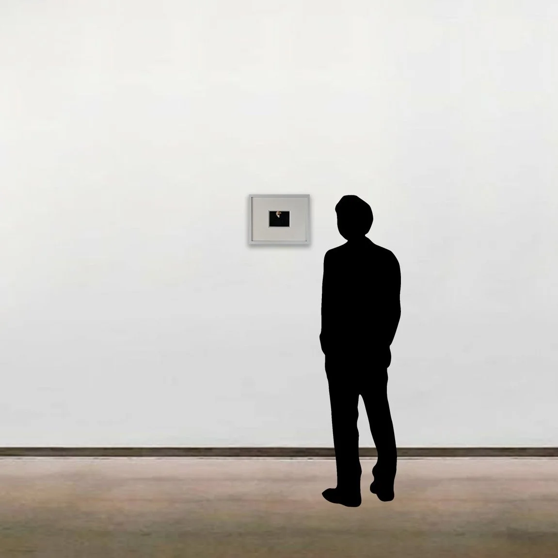Andy Warhol’s unique Polaroid photograph, 'Self-Portrait in Fright Wig', shown here framed alongside a six-foot figure for scale.