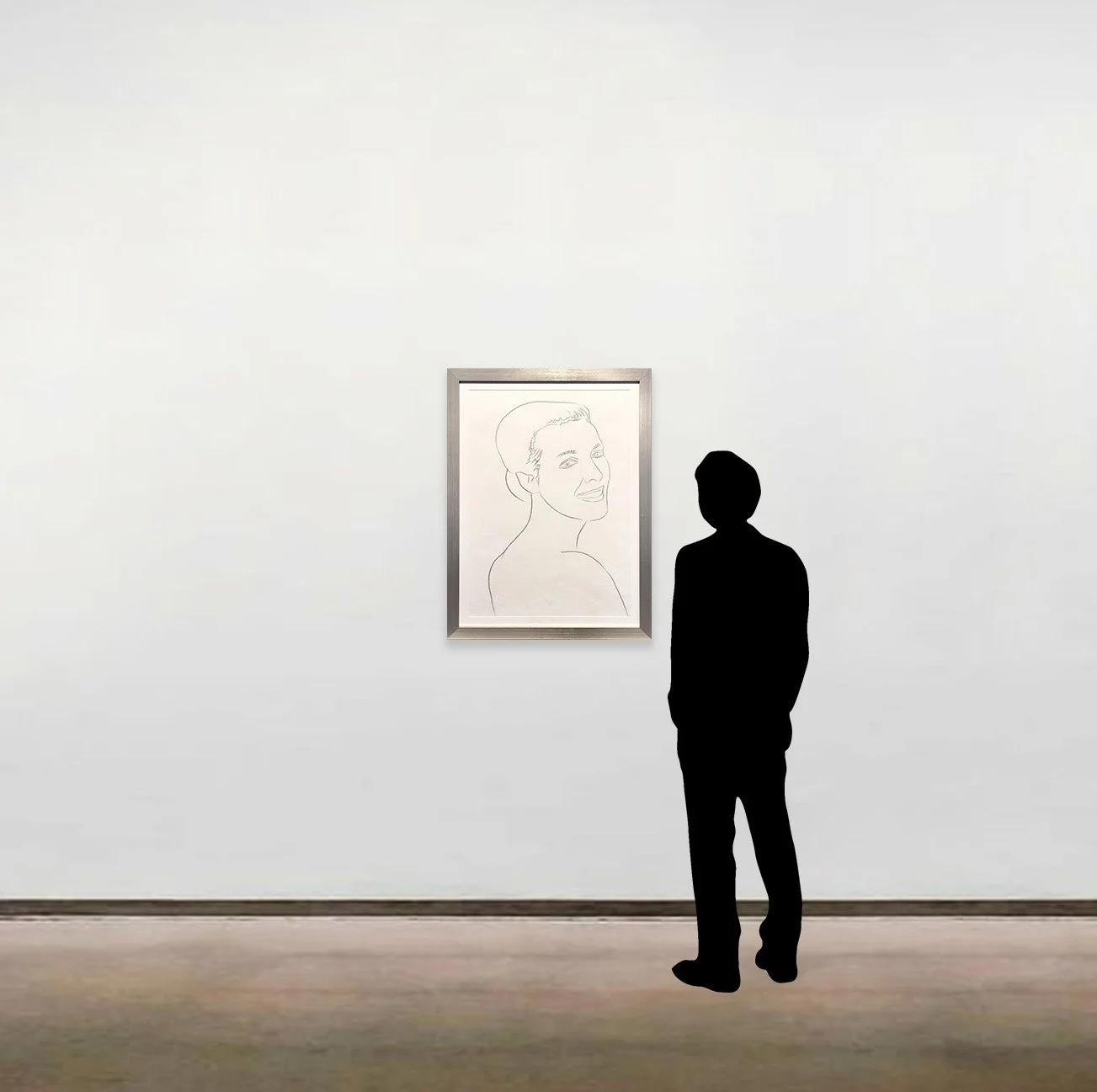 'Female Portrait' by Andy Warhol, a unique graphite on paper drawing, shown in a metallic frame alongside a six-foot figure.