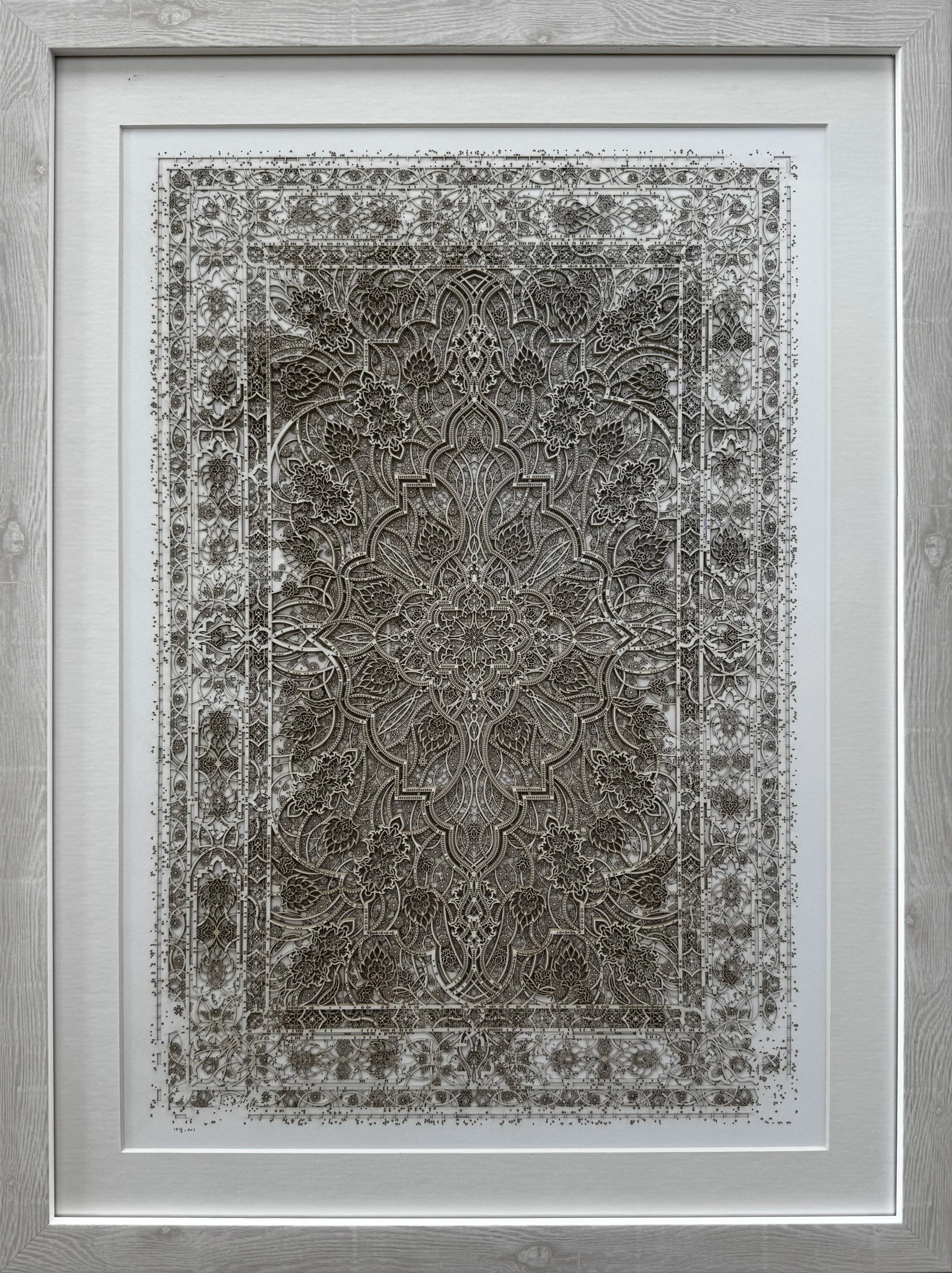 An image of Julia Ibbini’s layered paper work, 'The Space Between 2.4', shown here in a wood frame.