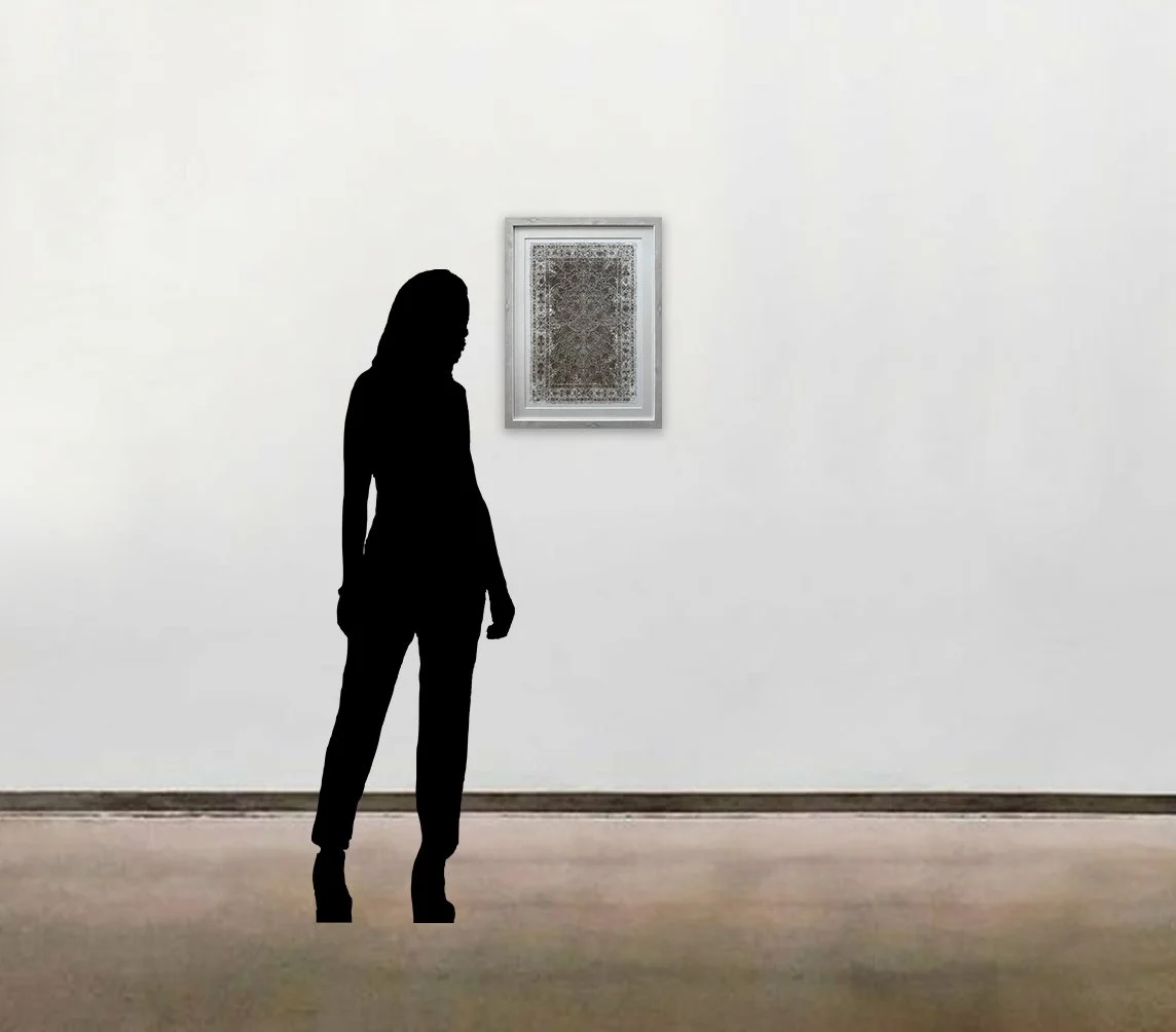 Julia Ibbini’s layered paper work, 'The Space Between 2.4', shown here framed to-scale alongside a six foot tall figure.
