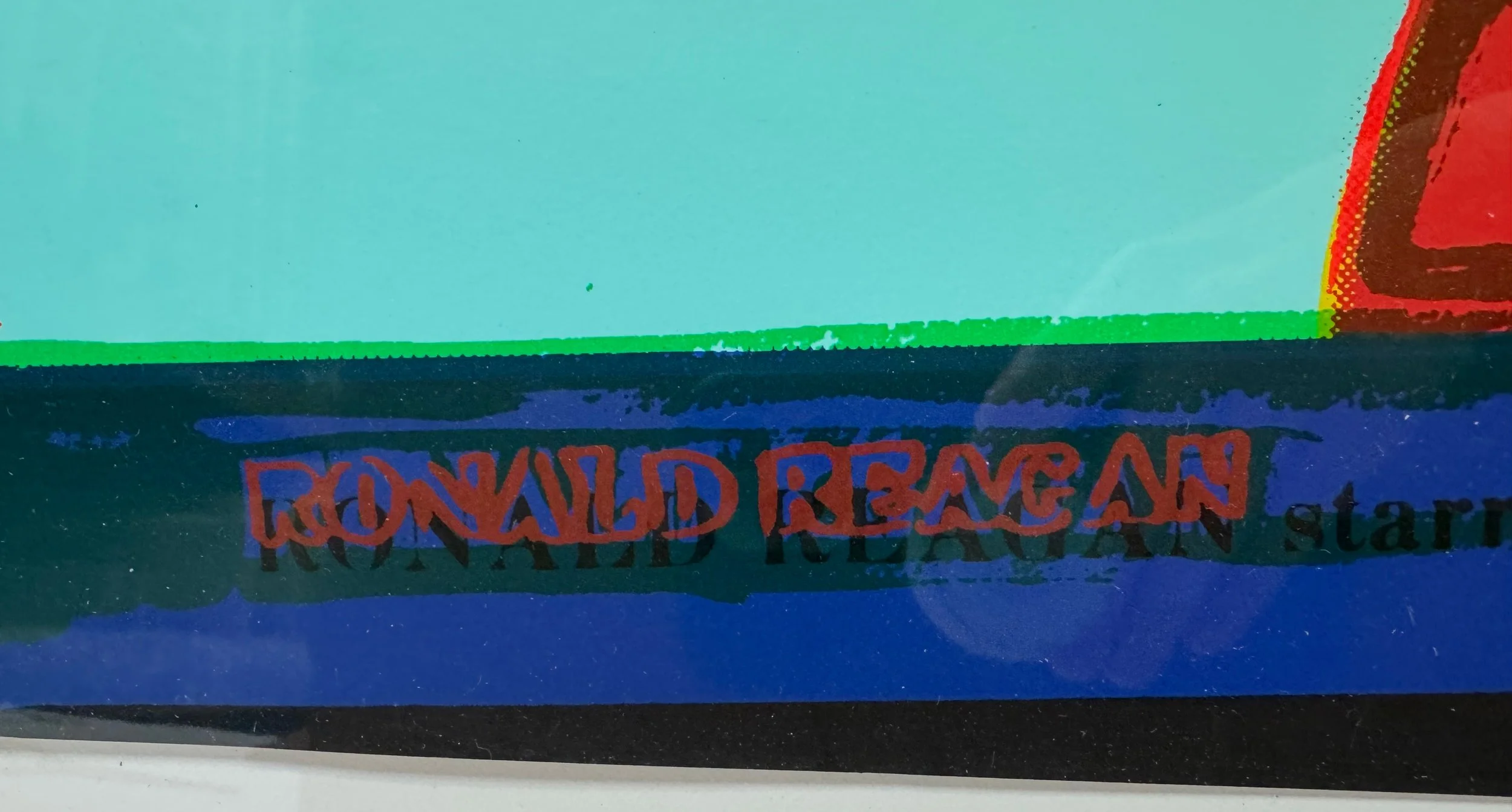 A lower left detail image of Andy Warhol’s screenprint on Lenox Museum Board, 'Van Heusen (Ronald Reagan)', dated 1986. The work is shown here framed.
