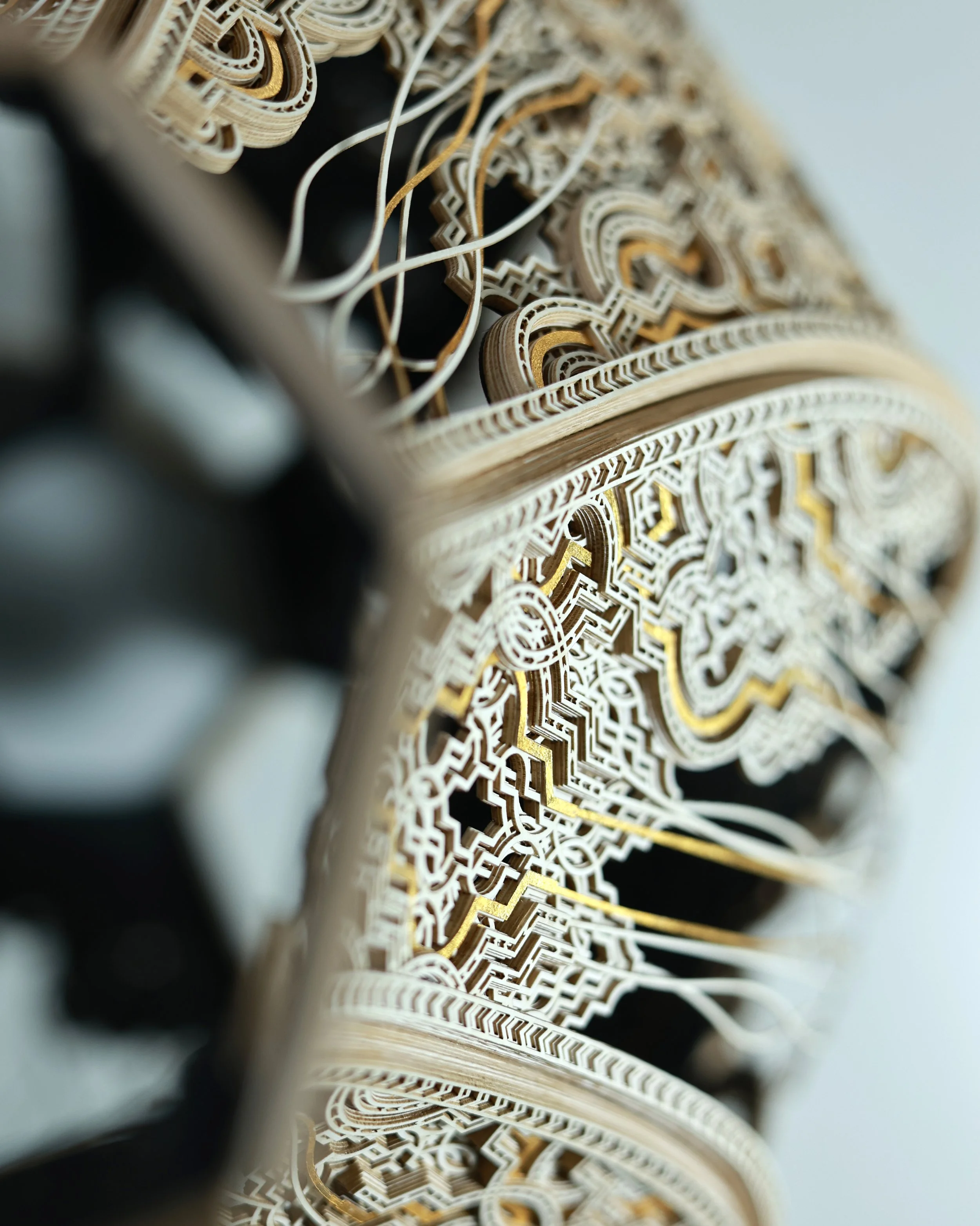 An overhead detail image of Julia Ibbini’s 'Kŷma | Vessel'. The work is comprised of paper, ink, cotton, and gold leaf.
