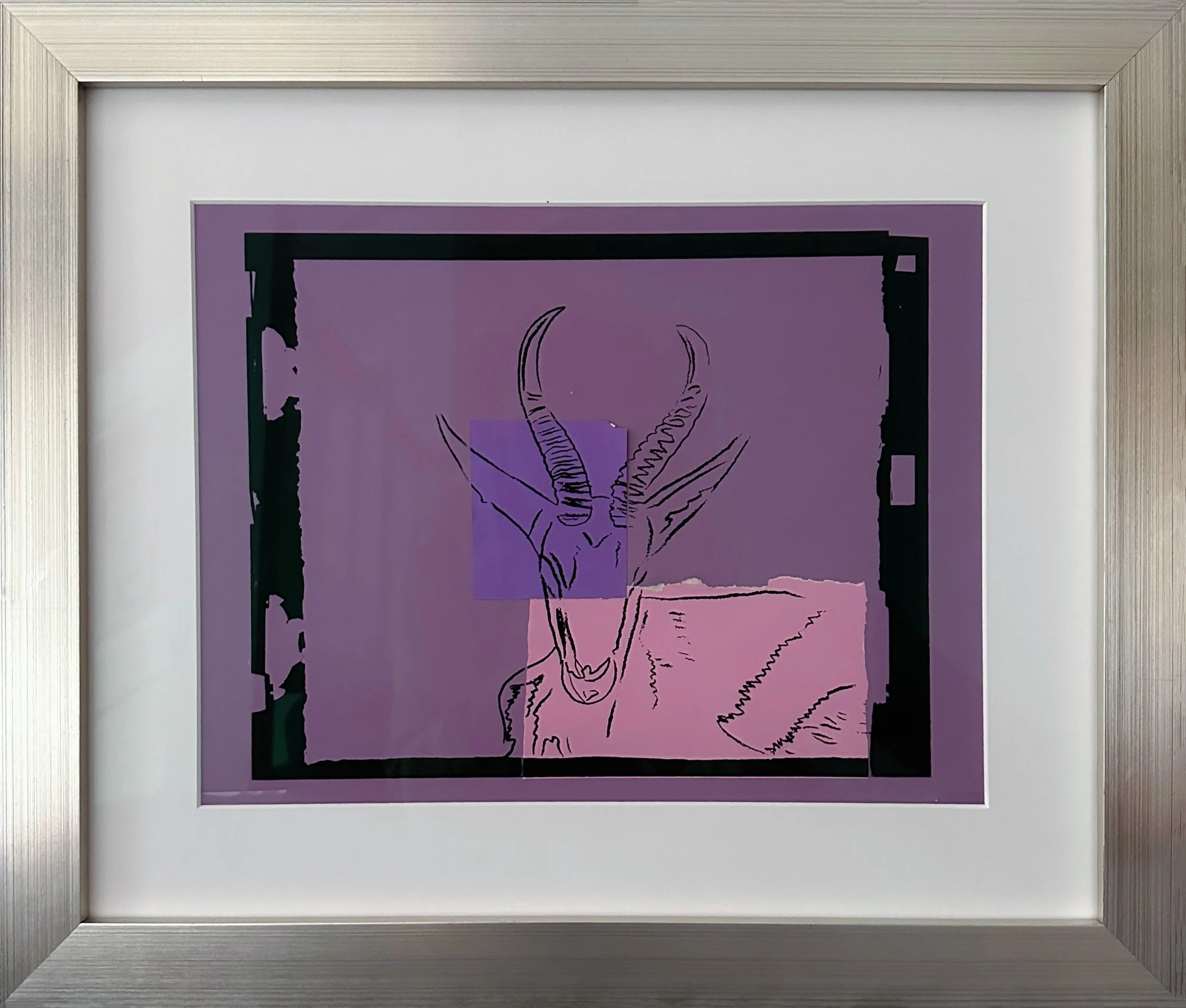 Andy Warhol’s 1986 unique silkscreen and colored paper collage work, Sömmering Gazelle, shown here in a silver frame.