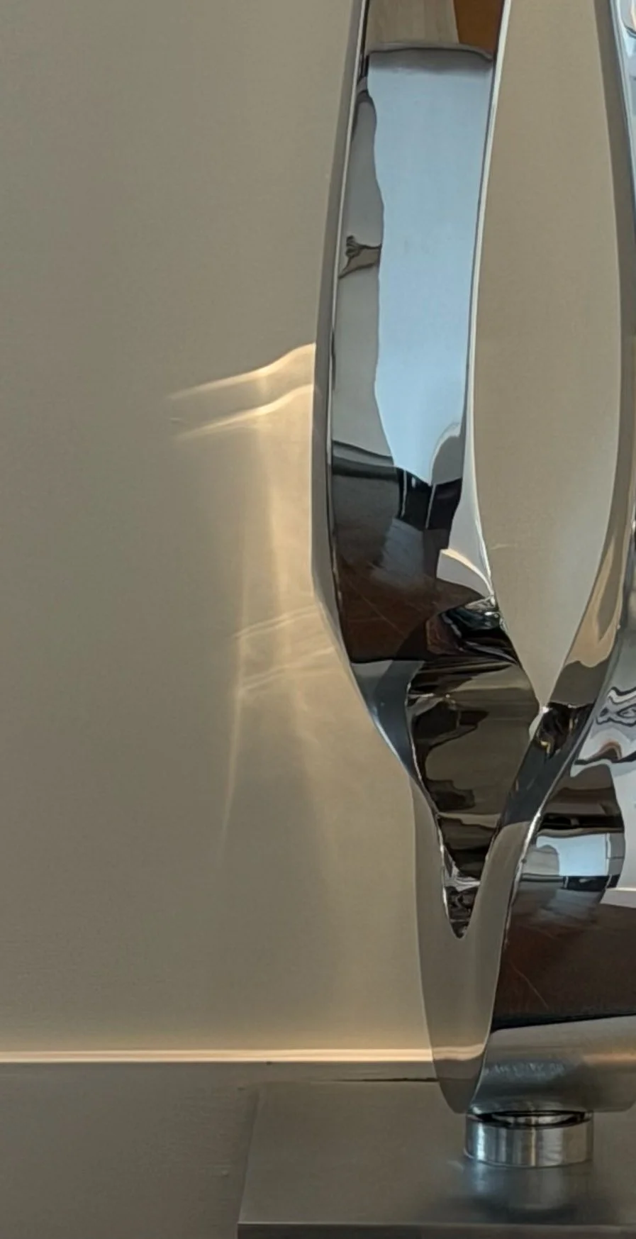 A detail image of 'Propeller' by Tarik Currimbhoy, an L316 Marine-grade stainless steel kinetic sculpture. The middle section of the work is shown here.